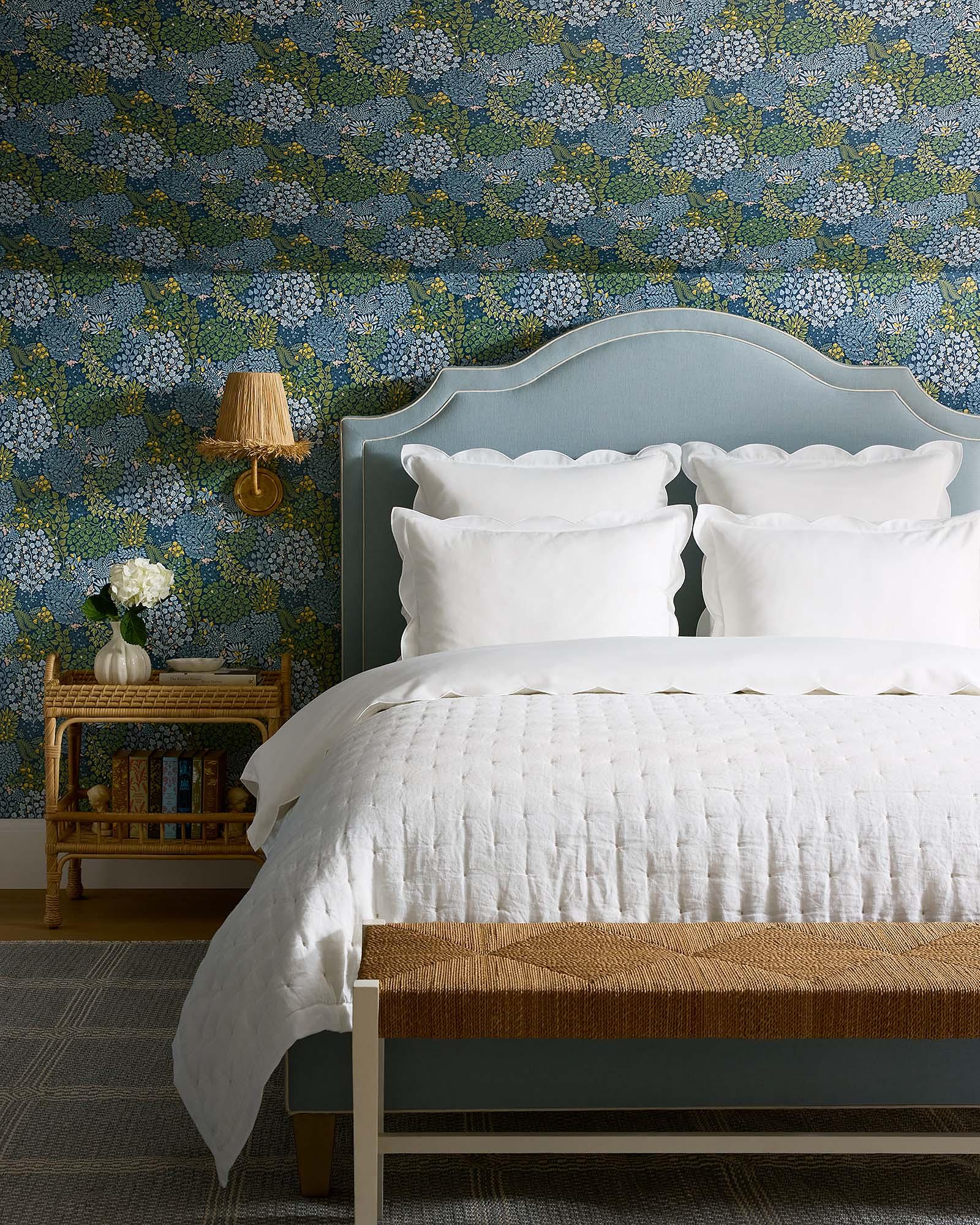 Bedroom-Coastal-Blue-Upholstered-Bed-Loire-Wisley-Floral-Wallpaper-White-Sutter-Linen-Quilt-brand-x13803_CV1