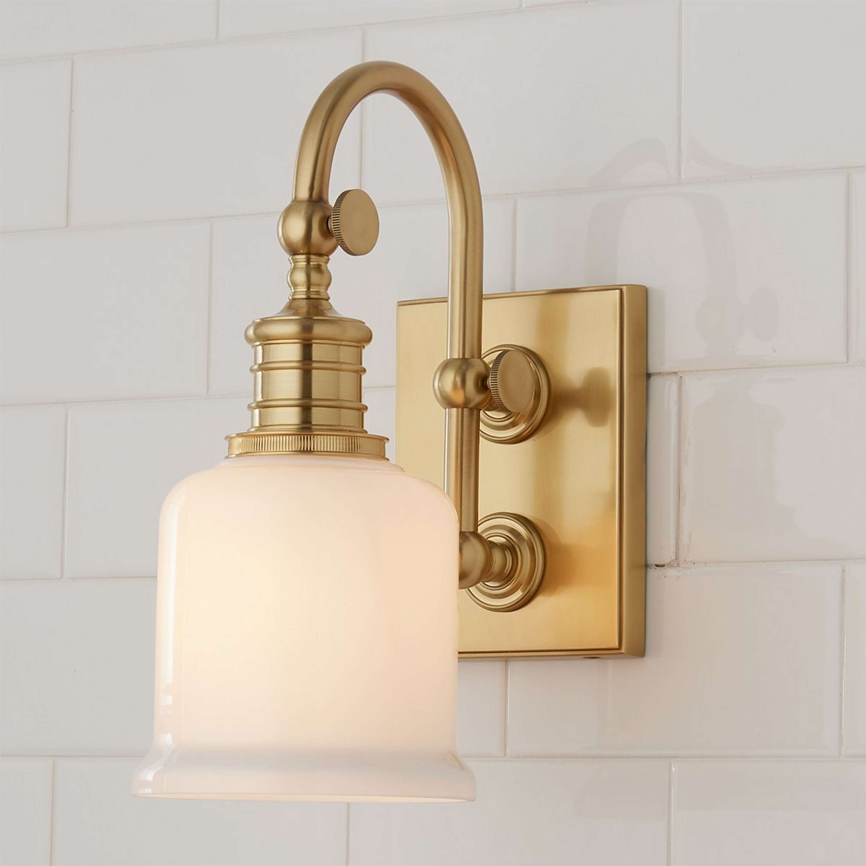 A Well Appointed Bath Sconce with Antique Brass / Opal Glass color