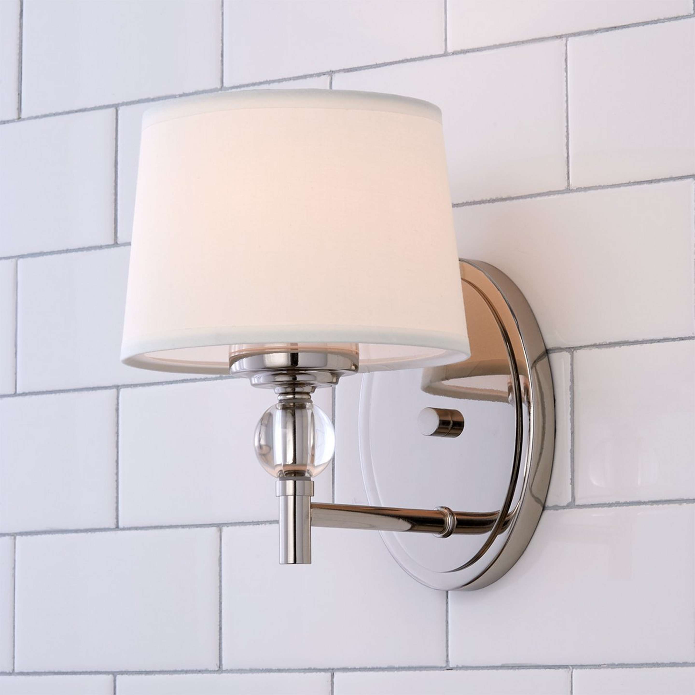 A Crystal Accent Bath Sconce with Polished Nickel / Crystal / White color