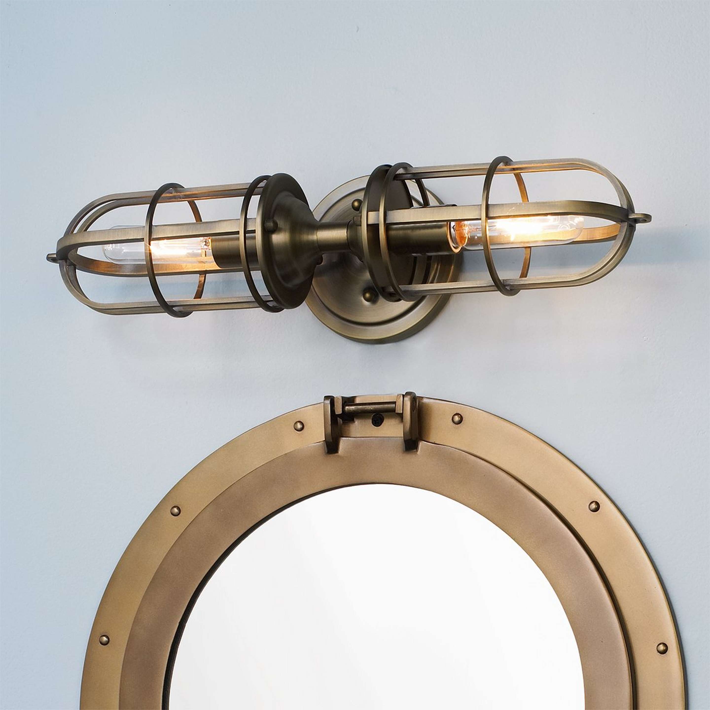 A Nautical Cage Vanity Light - 2 Light with Antique Brass color