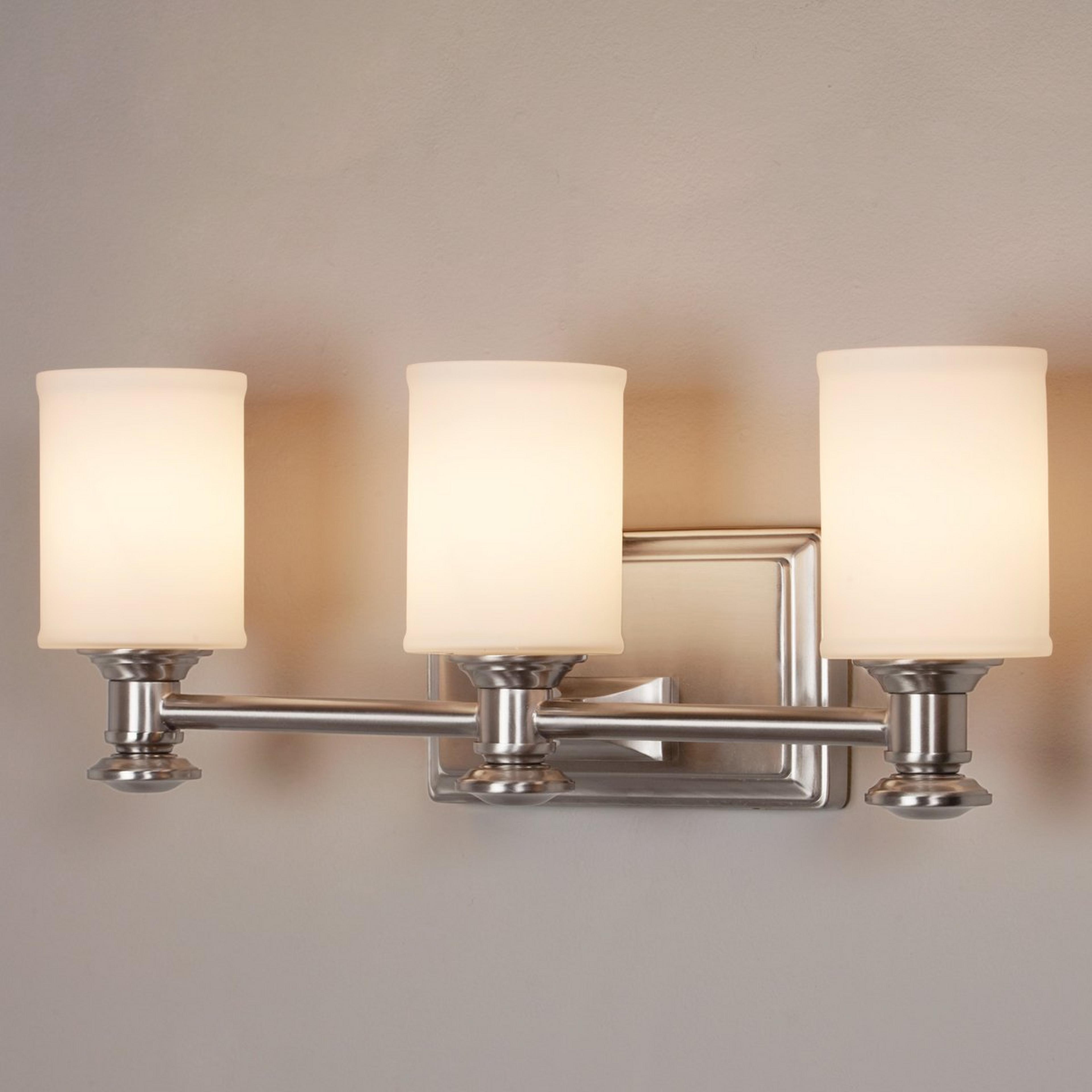 A Traditional Urban Vanity Light - 3 Light with Brushed Nickel / White Glass color