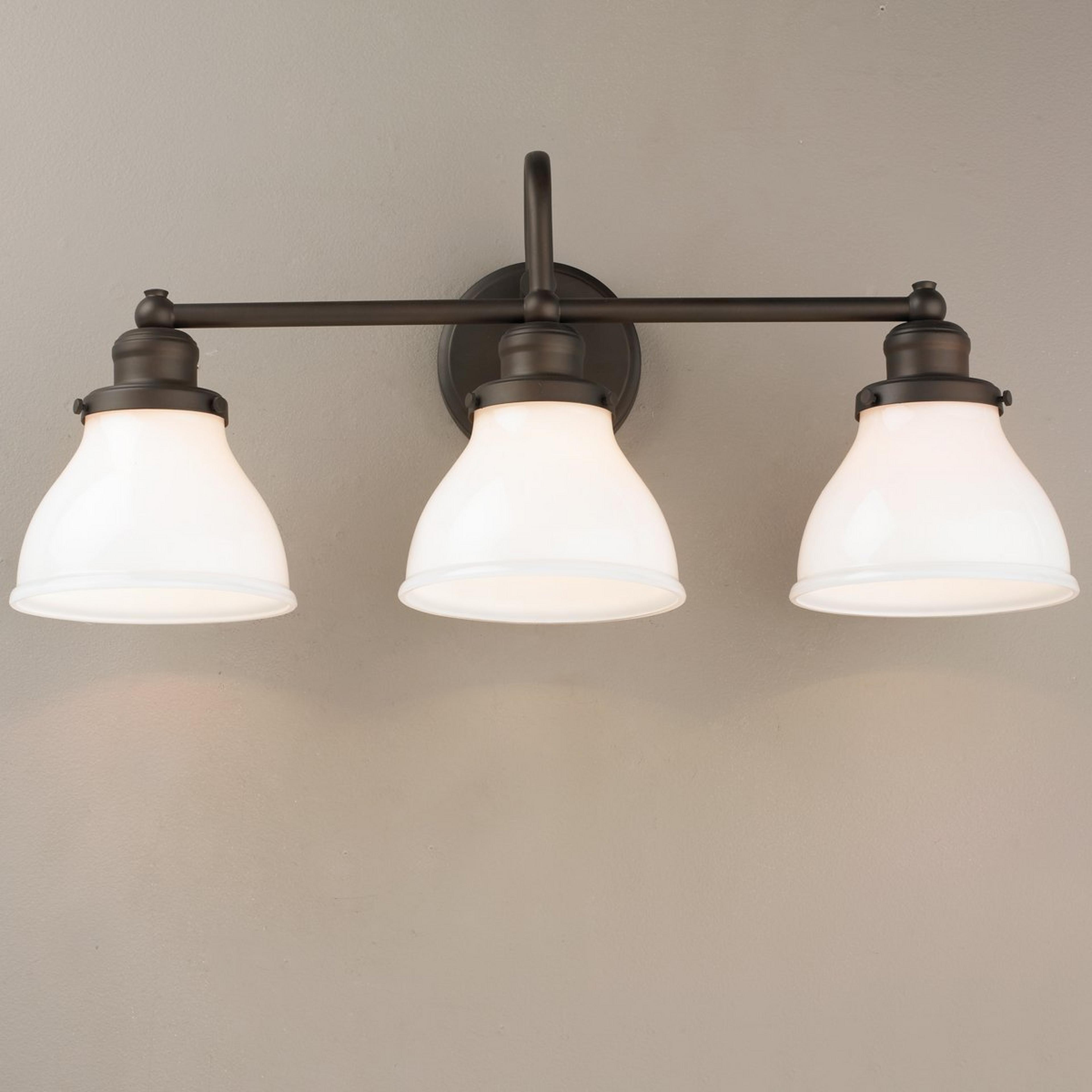 A Montpelier Vanity Light - 3 Light - Milk with Burnished Bronze / Milk Glass color