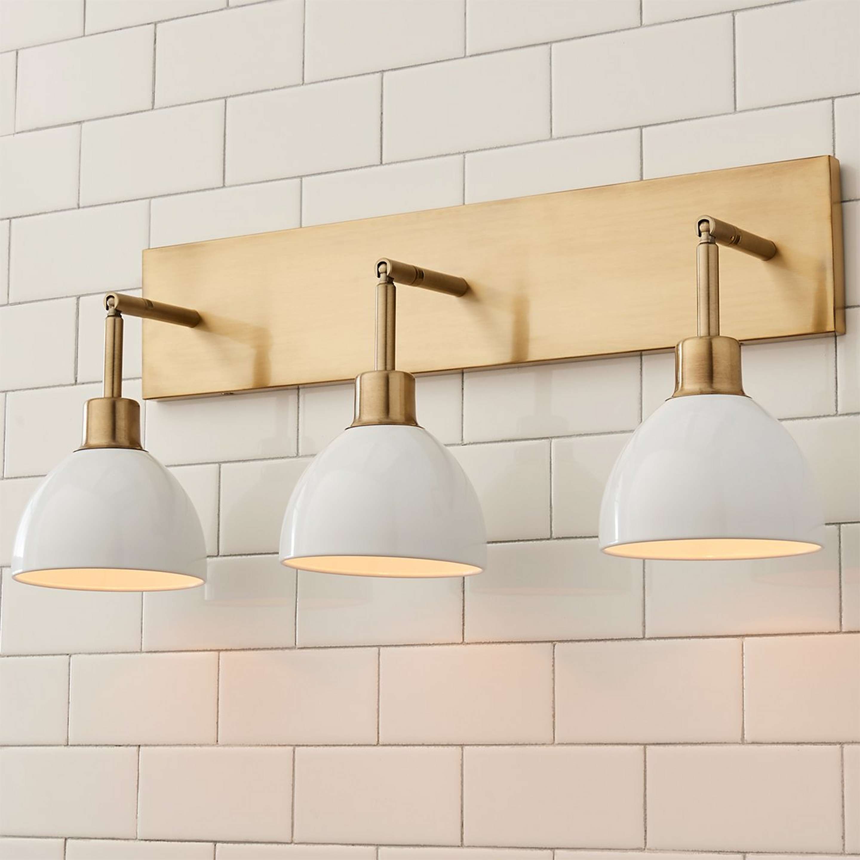 A Young House Love Dapper Vanity Light - 3 Light with Brushed Brass / White color