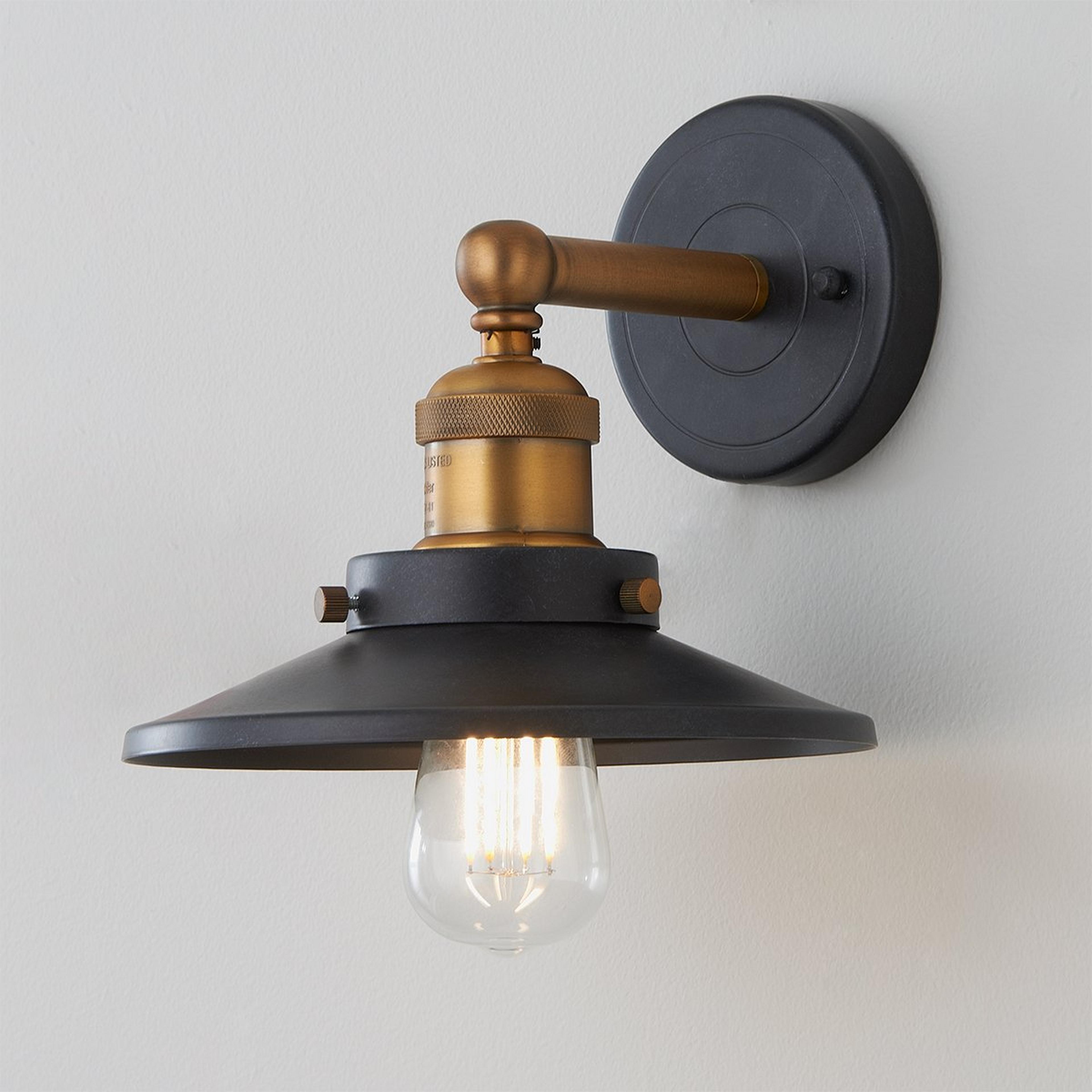 A Metro Shaded Sconce with Graphite / Antique Brass color