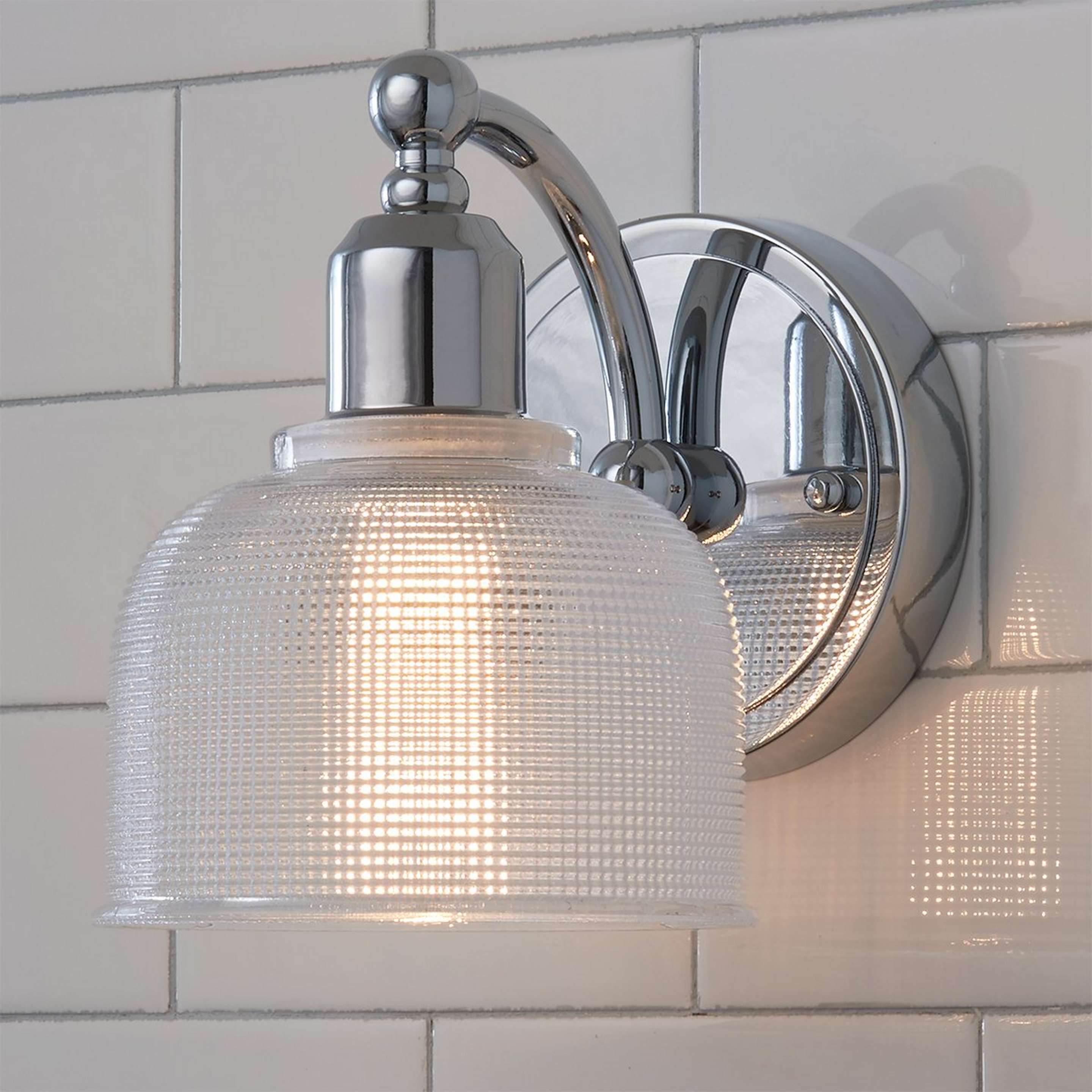 A Prismatic Glass Sconce with Chrome / Faceted Glass color