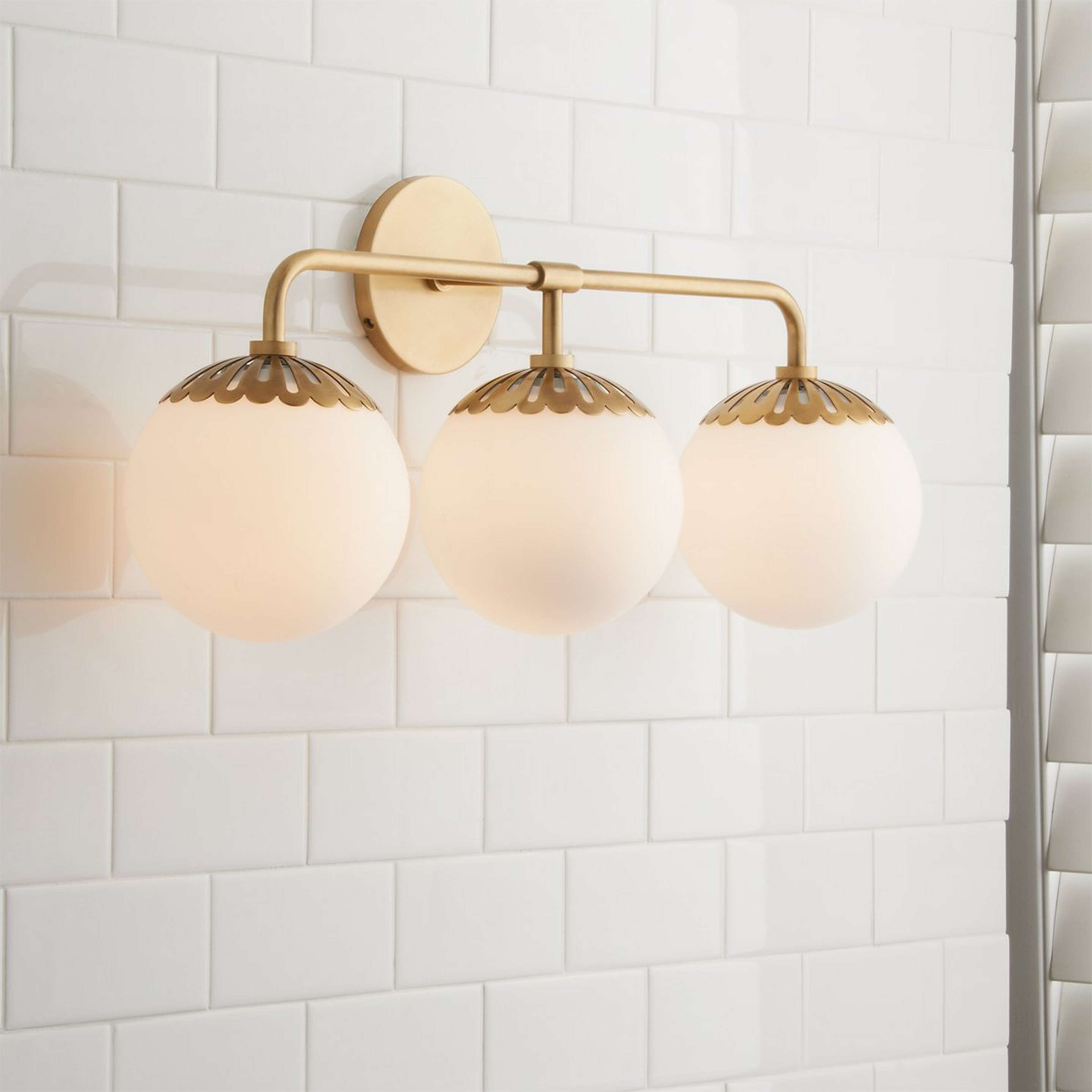 A Dewdrop Globe Vanity Light - 3 light with Satin Brass color