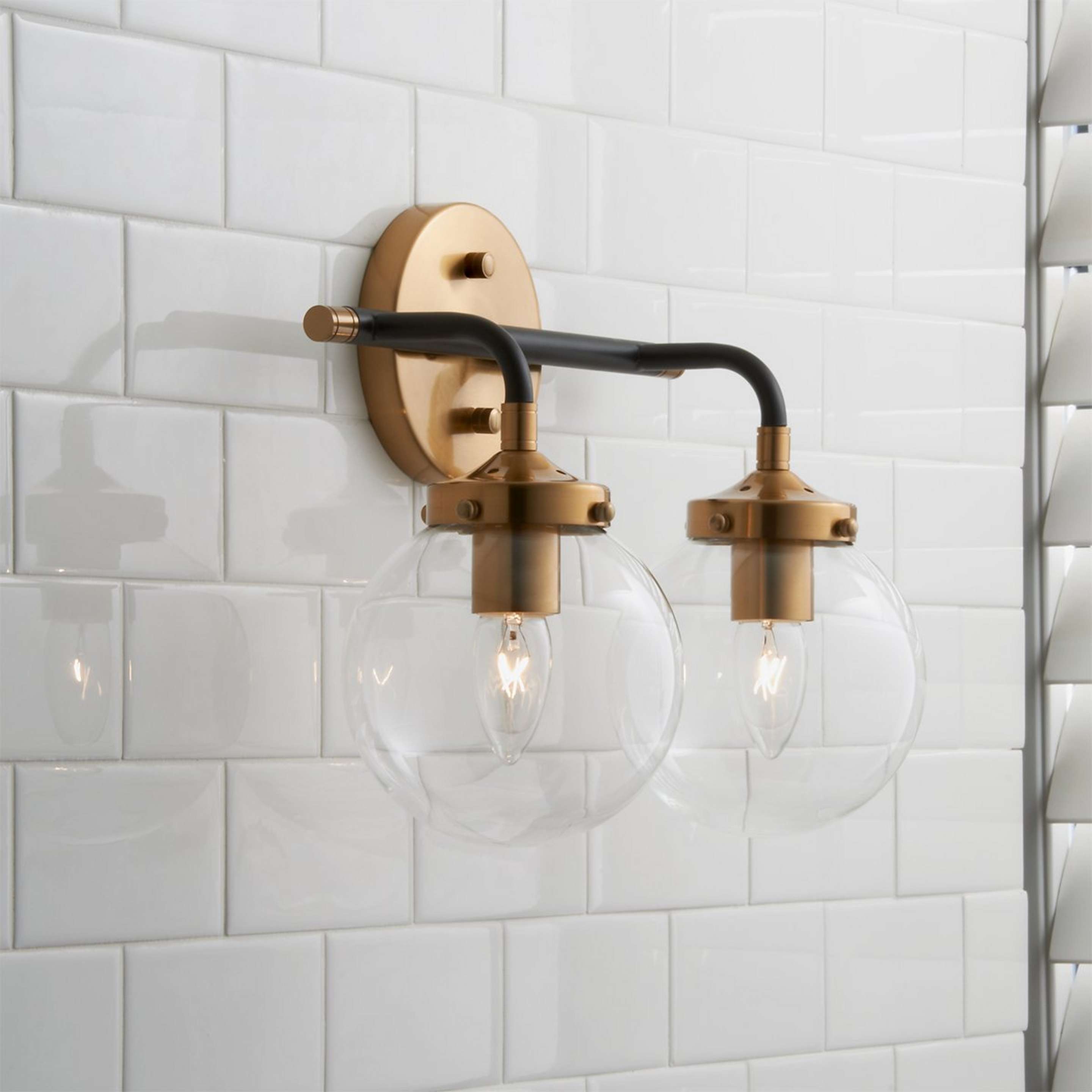 A Mixed Metal Globe Vanity Light - 2 light with Antique Gold / Matte Black color