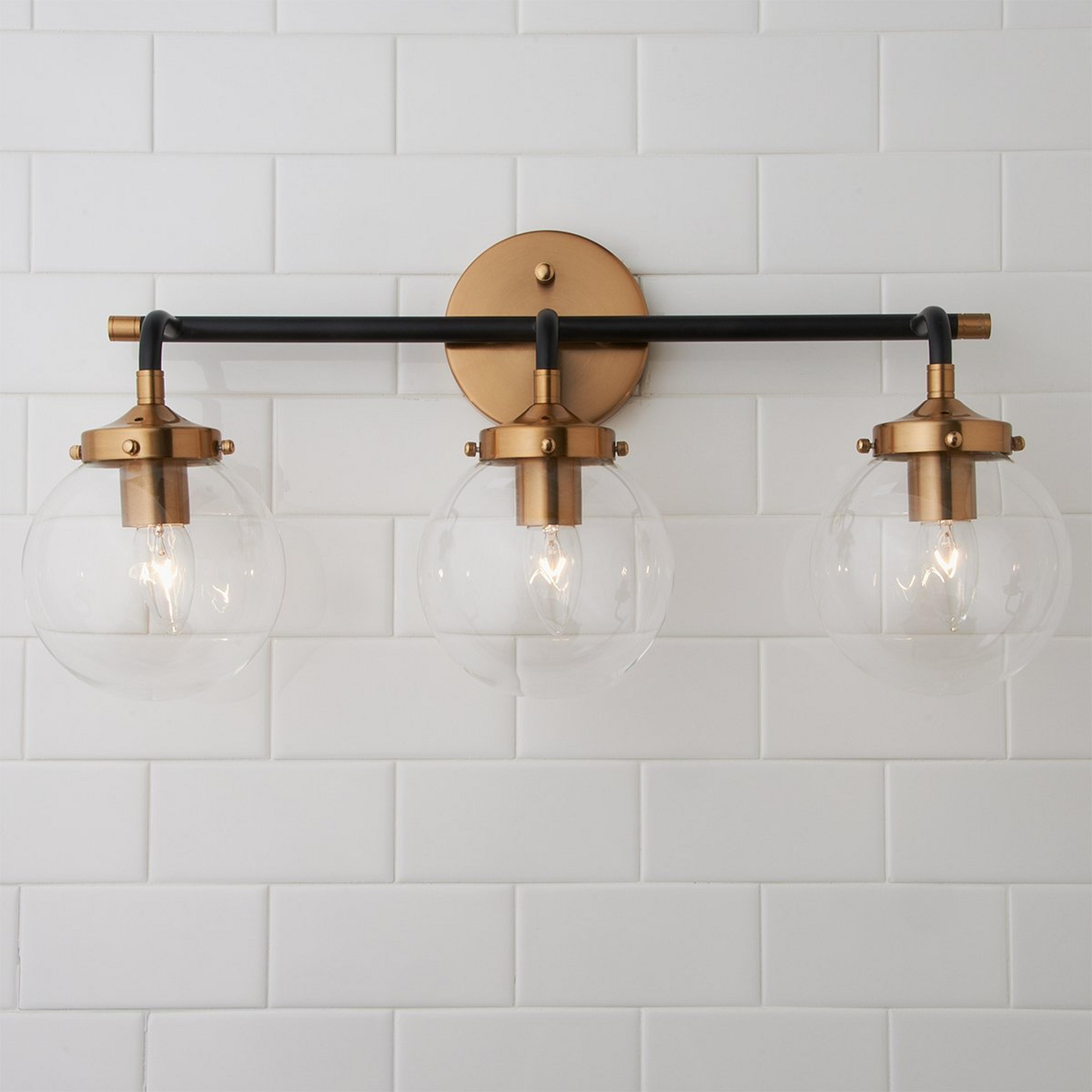 A Mixed Metal Globe Vanity Light - 3 light with undefined color