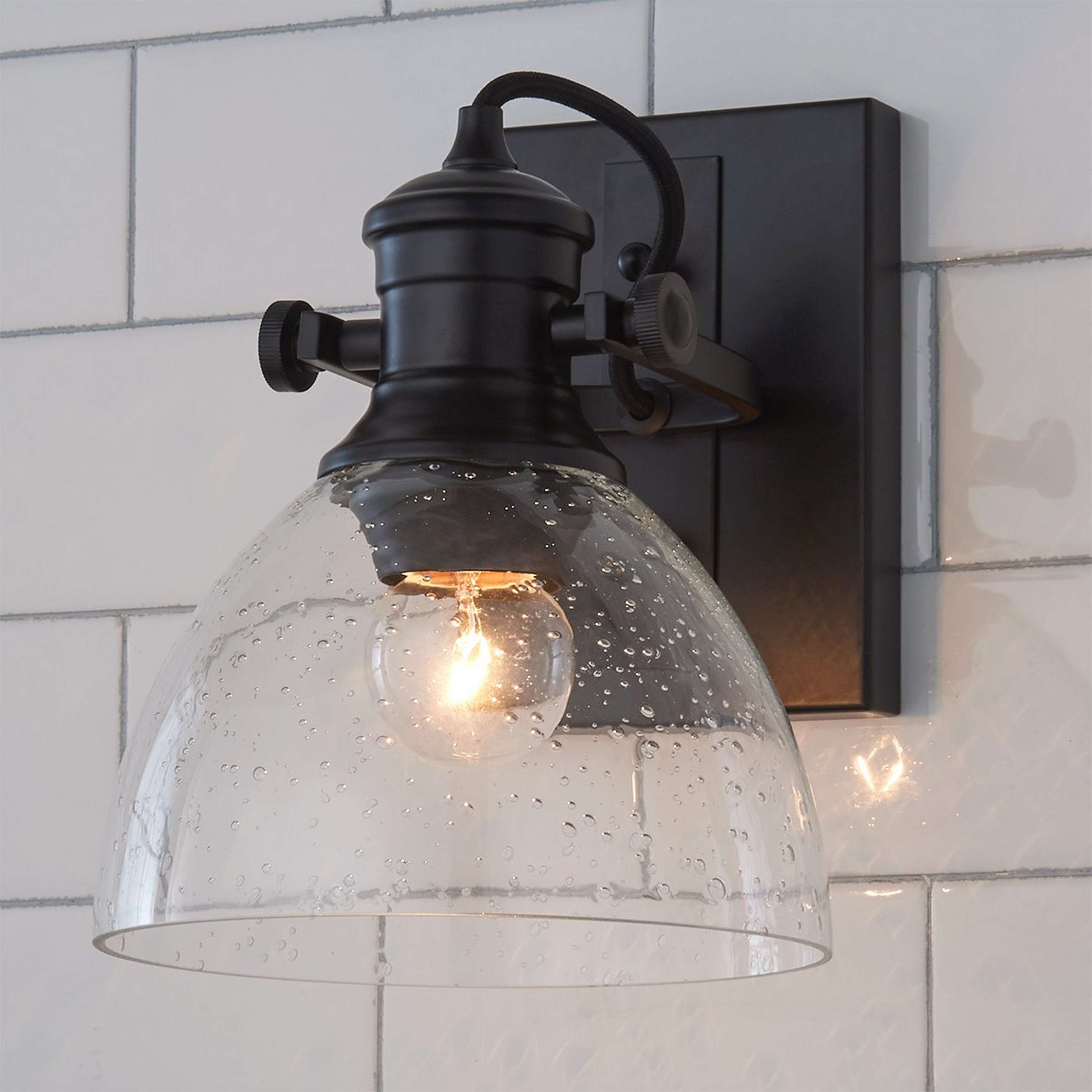 A Gwynn Isle Dome Sconce with Black / Clear Seeded Glass color