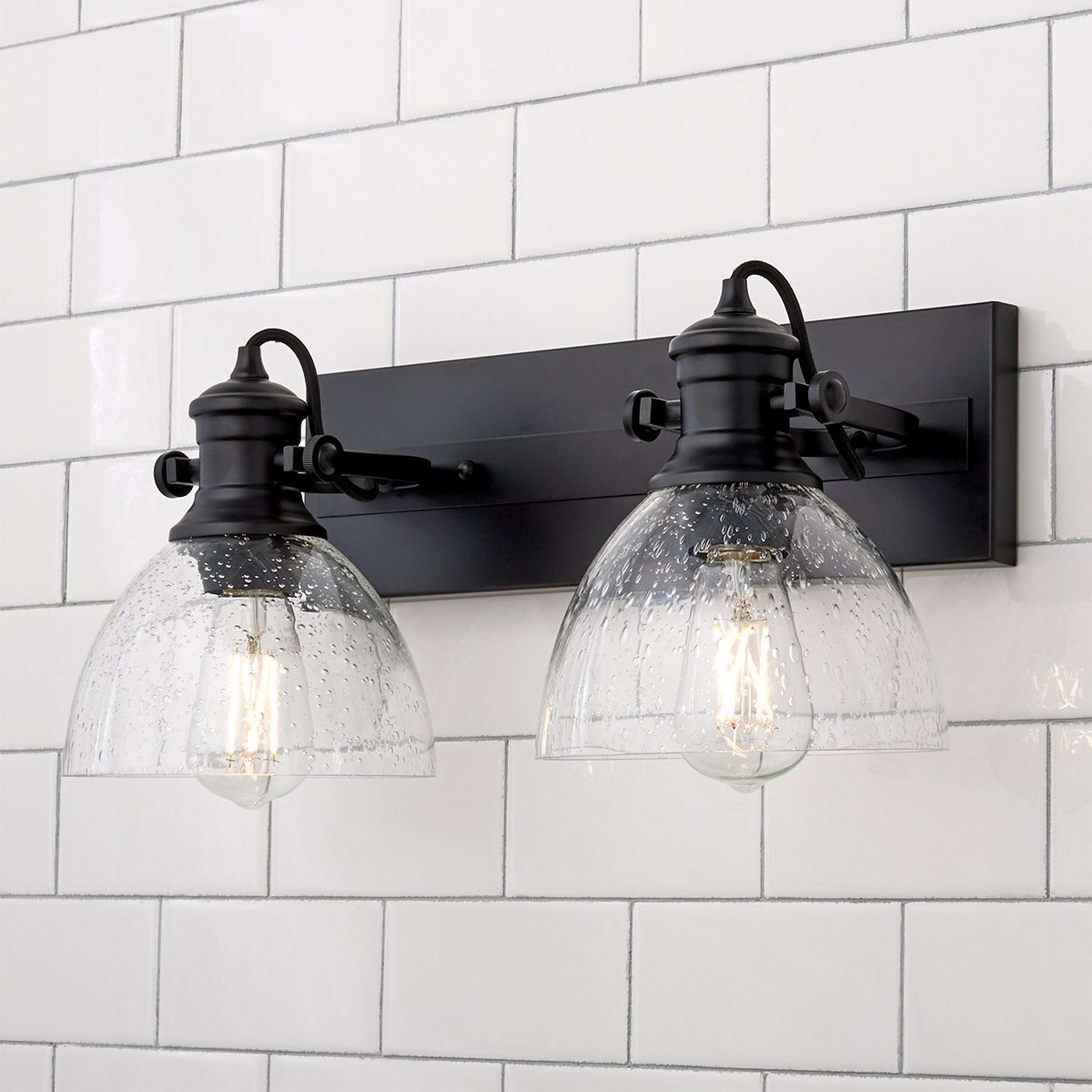 A Gwynn Isle Dome Vanity Light - 2 light with Black / Clear Seeded Glass color