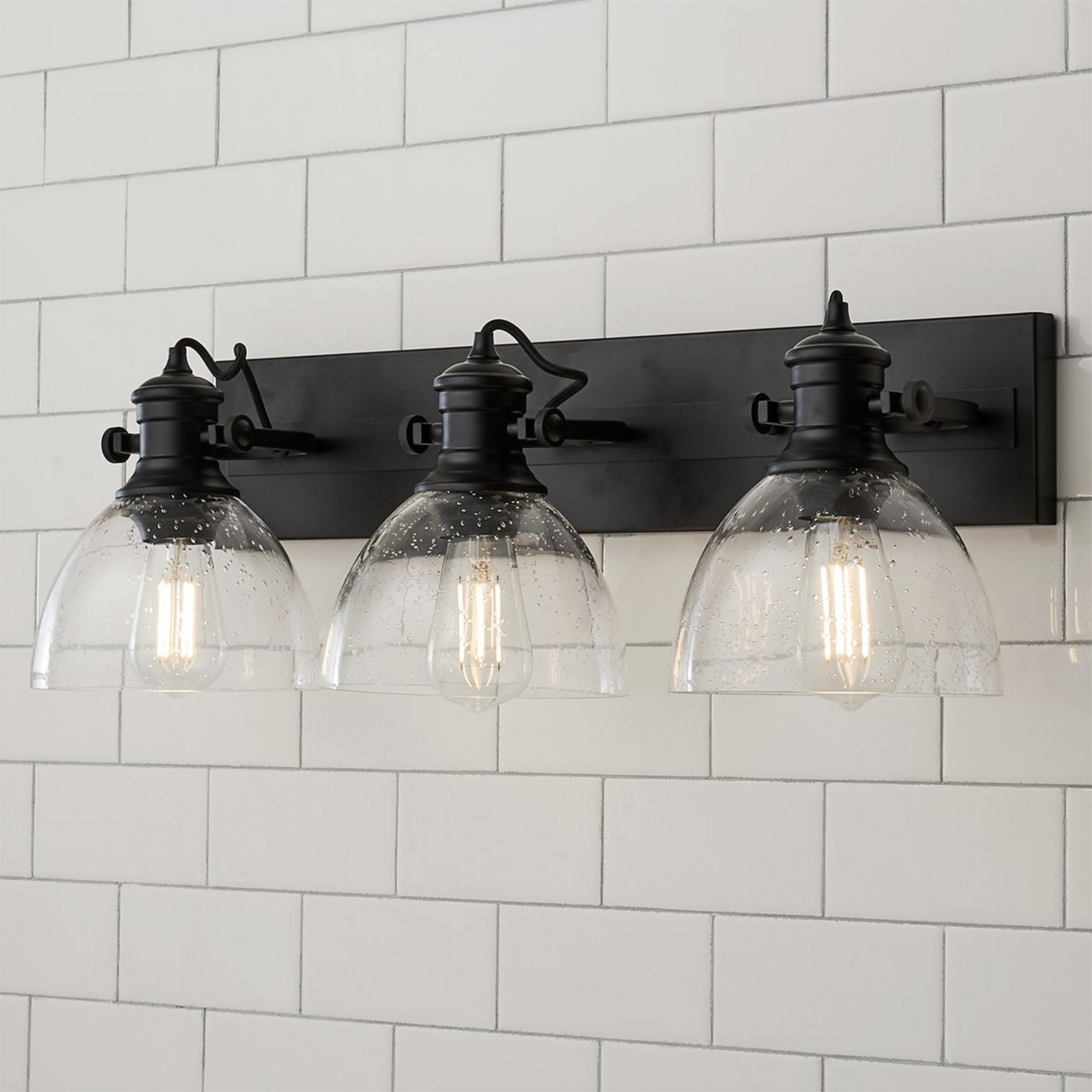 A Gwynn Isle Dome Vanity Light - 3 light with Black / Clear Seeded Glass color