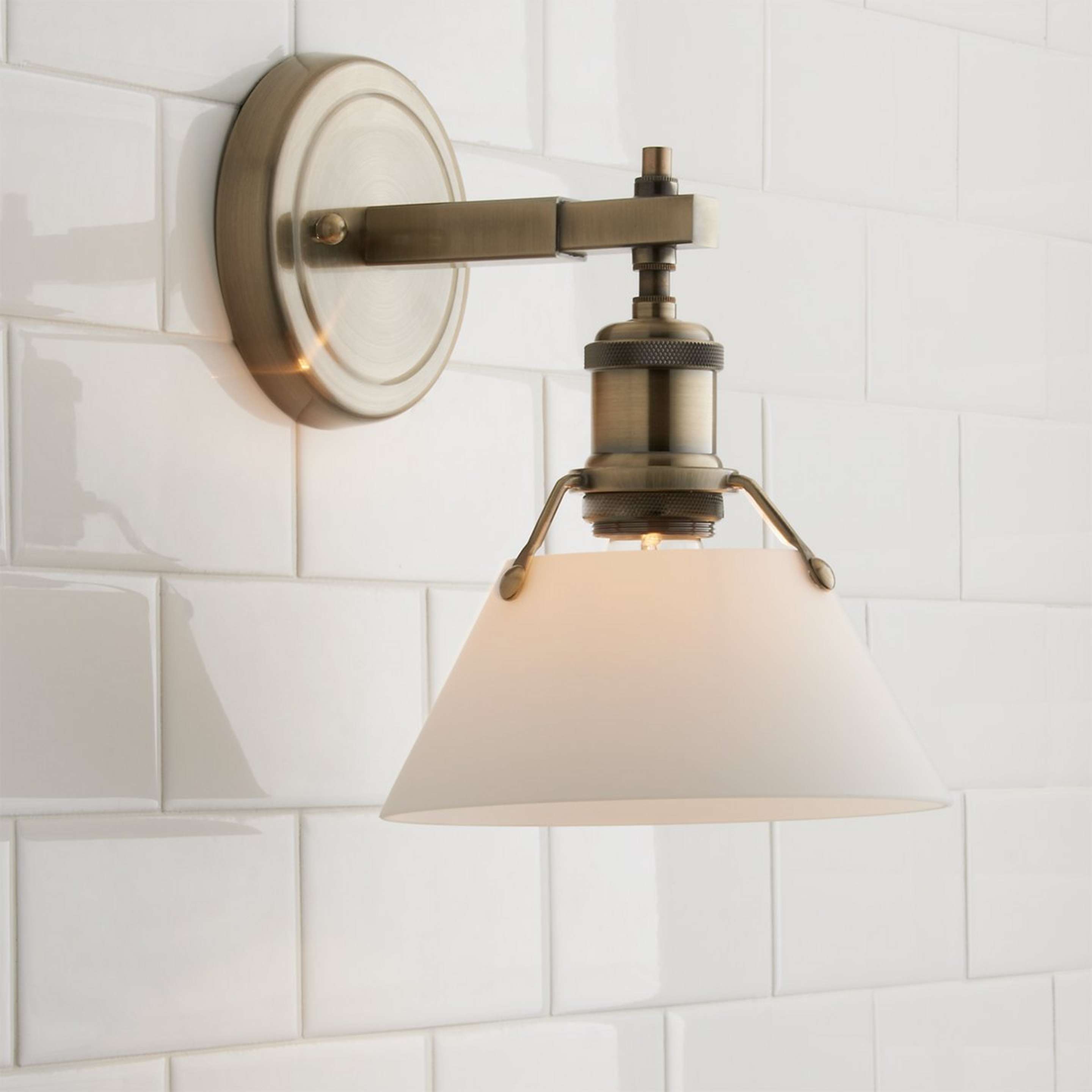 A Truncated Cone Shade Sconce with Aged Brass / White Glass color