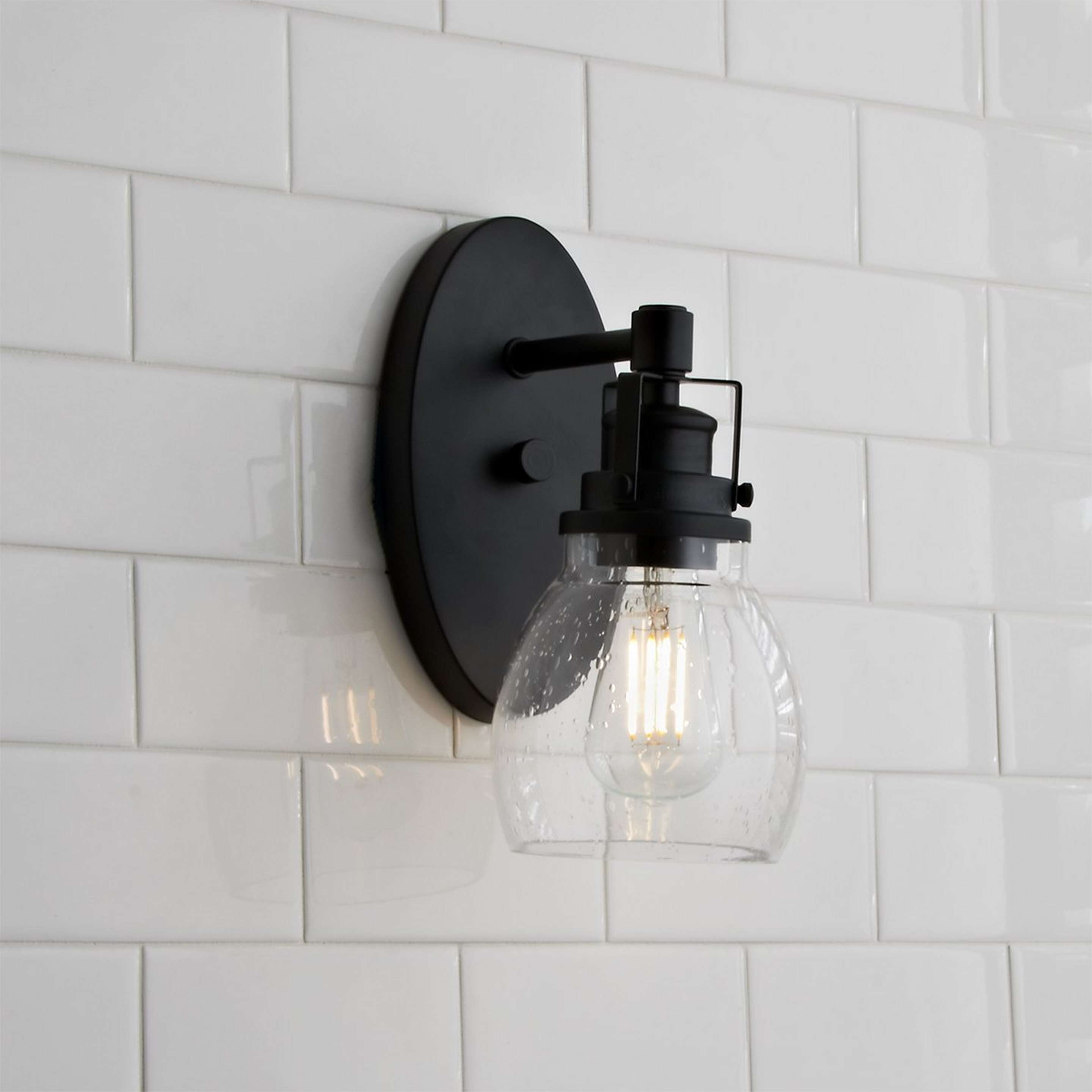 A Soft Seeded Bath Sconce with Matte Black / Seeded Glass color