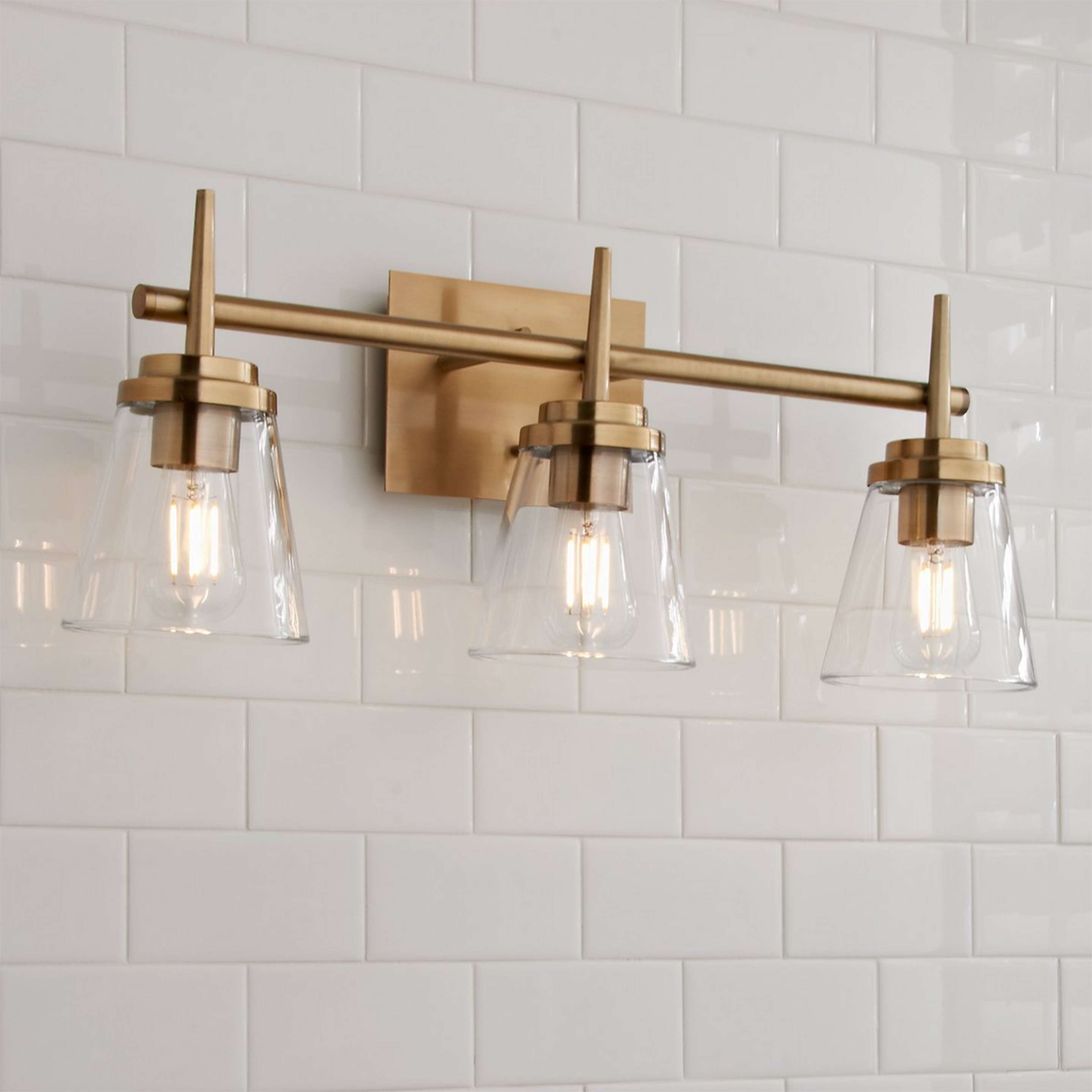 A Tapered Spike Vanity Light - 3 Light with Brushed Gold / Clear color