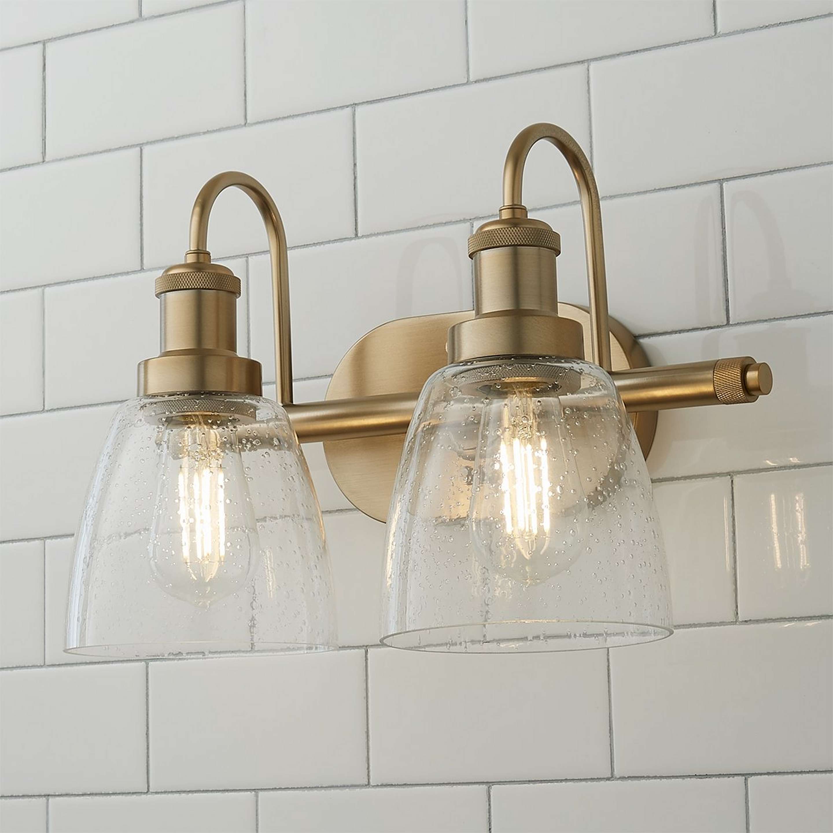 A Versatile Vanity Light - 2 Light with Aged Brass / Clear Seeded Glass color