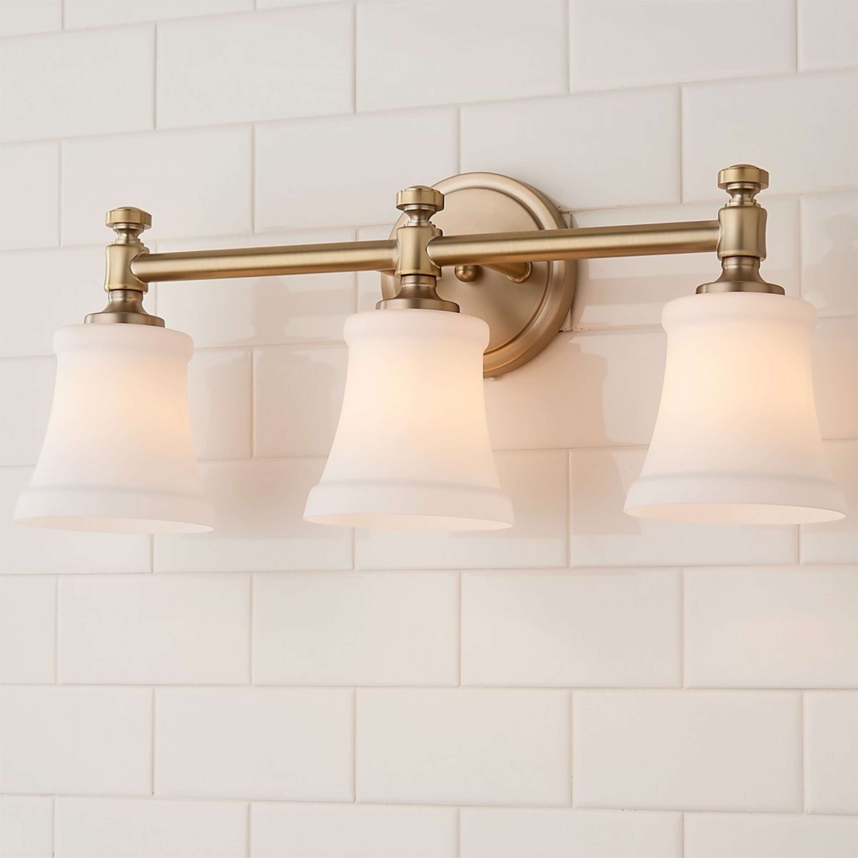 A Mercer White Glass Vanity Light - 3 Light with Aged Brass / Opal color