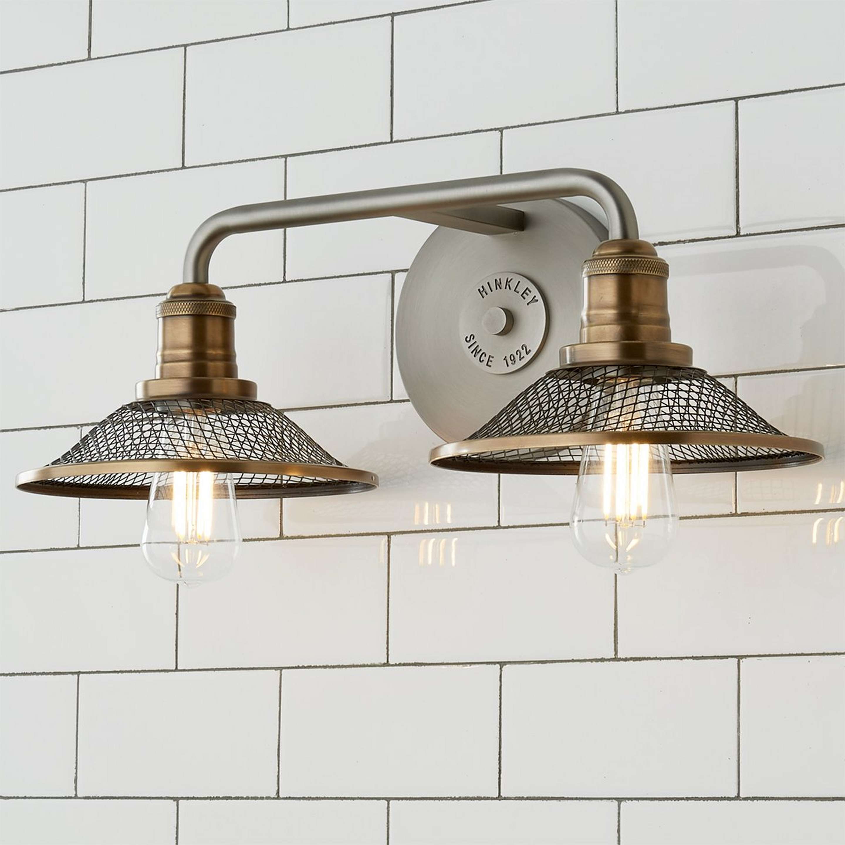 A Retro Warehouse Shade Vanity Light - 2 Light with Antique Nickel / Brass color