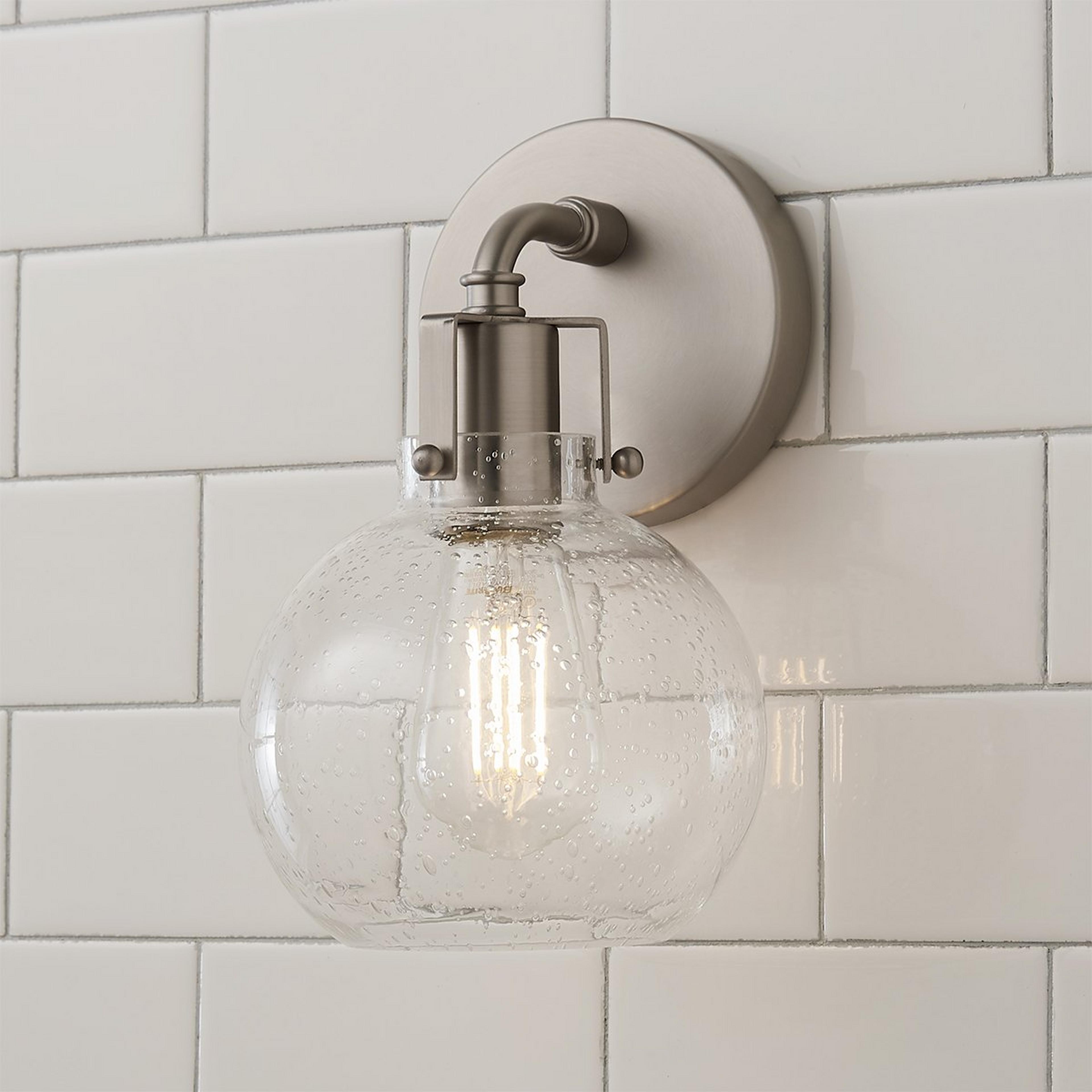 A Hinley Seeded Glass Sconce with Satin Nickel color