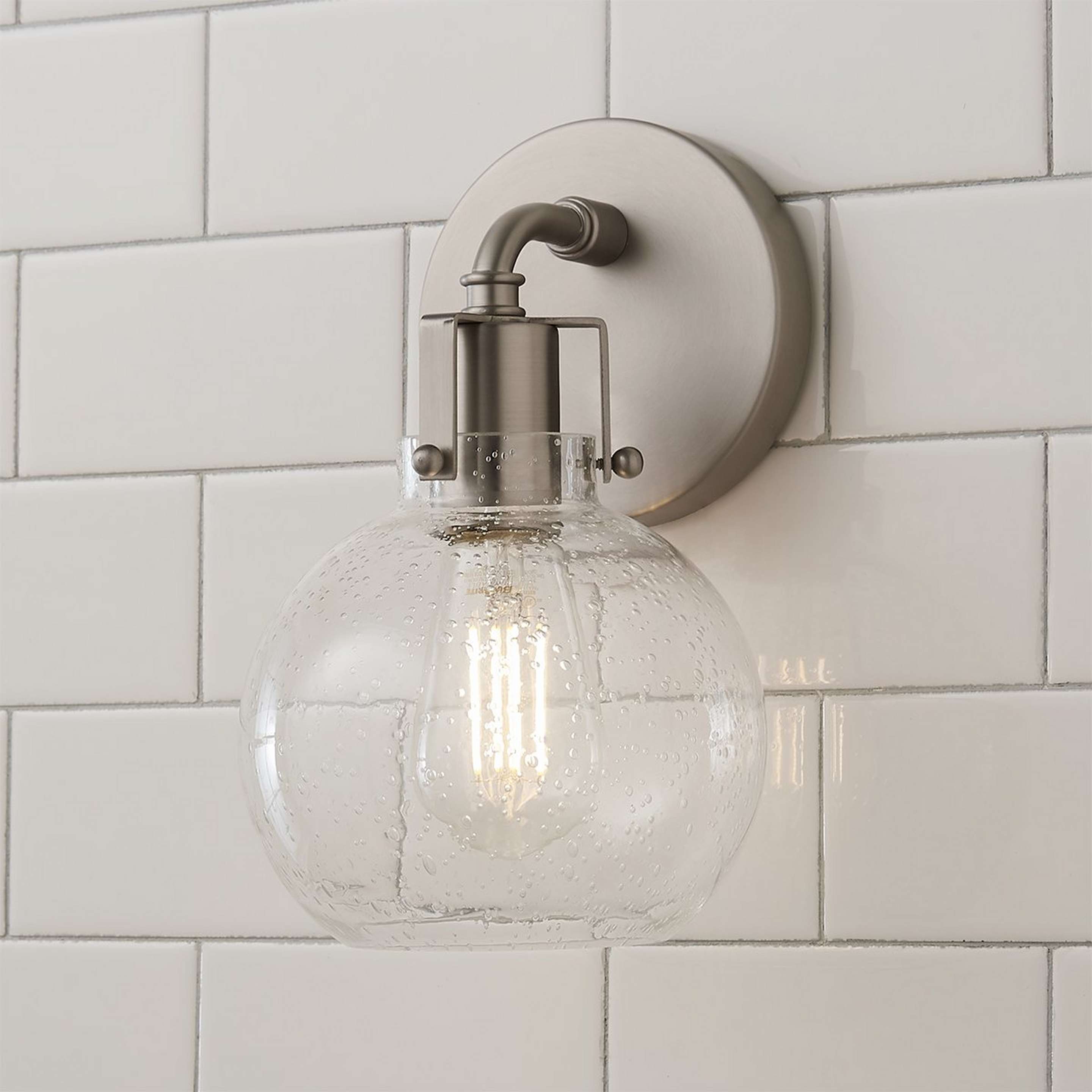 A Hinley Seeded Glass Sconce with Satin Nickel color