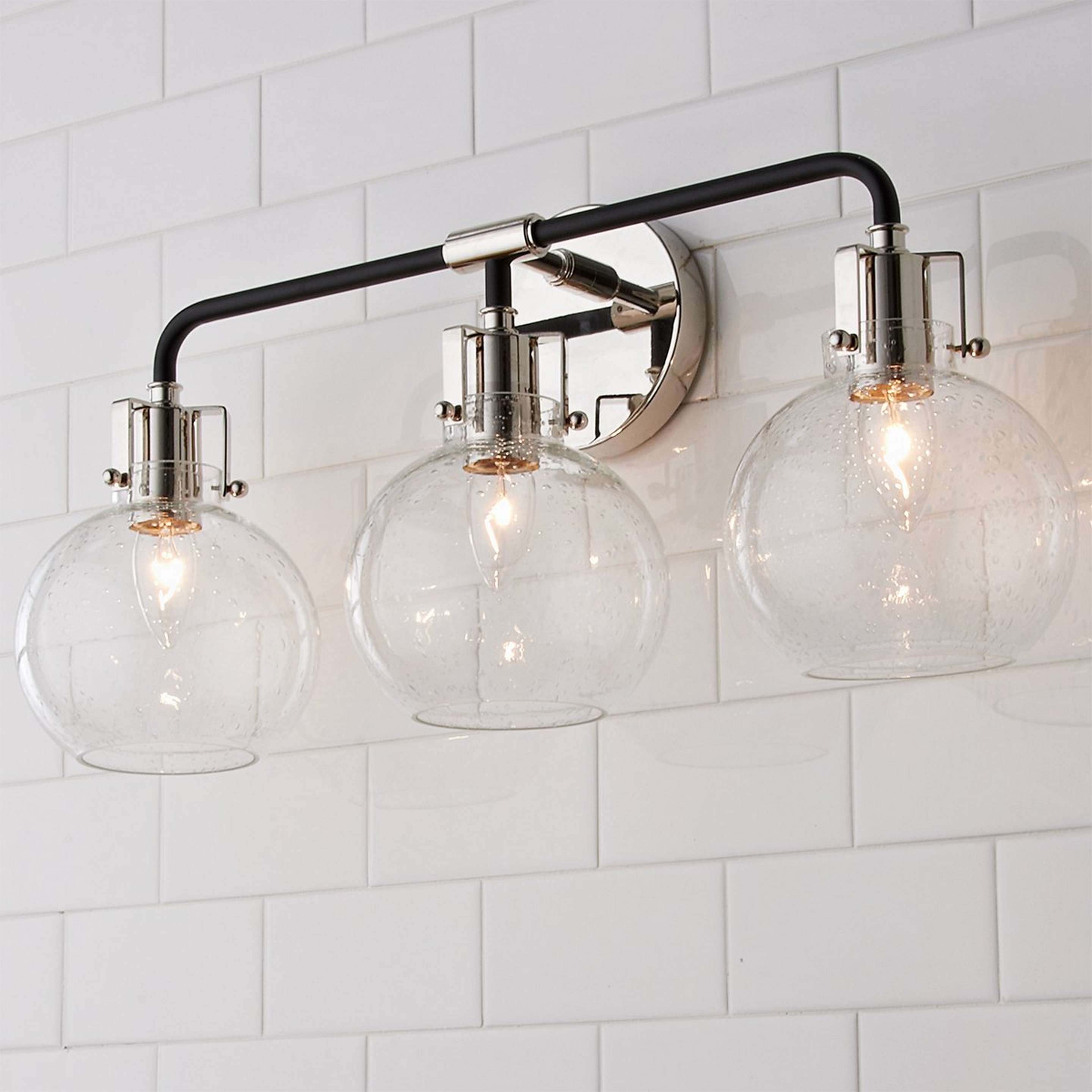 A Hinley Seeded Glass Vanity Light - 3 Light with Polished Nickel / Black color