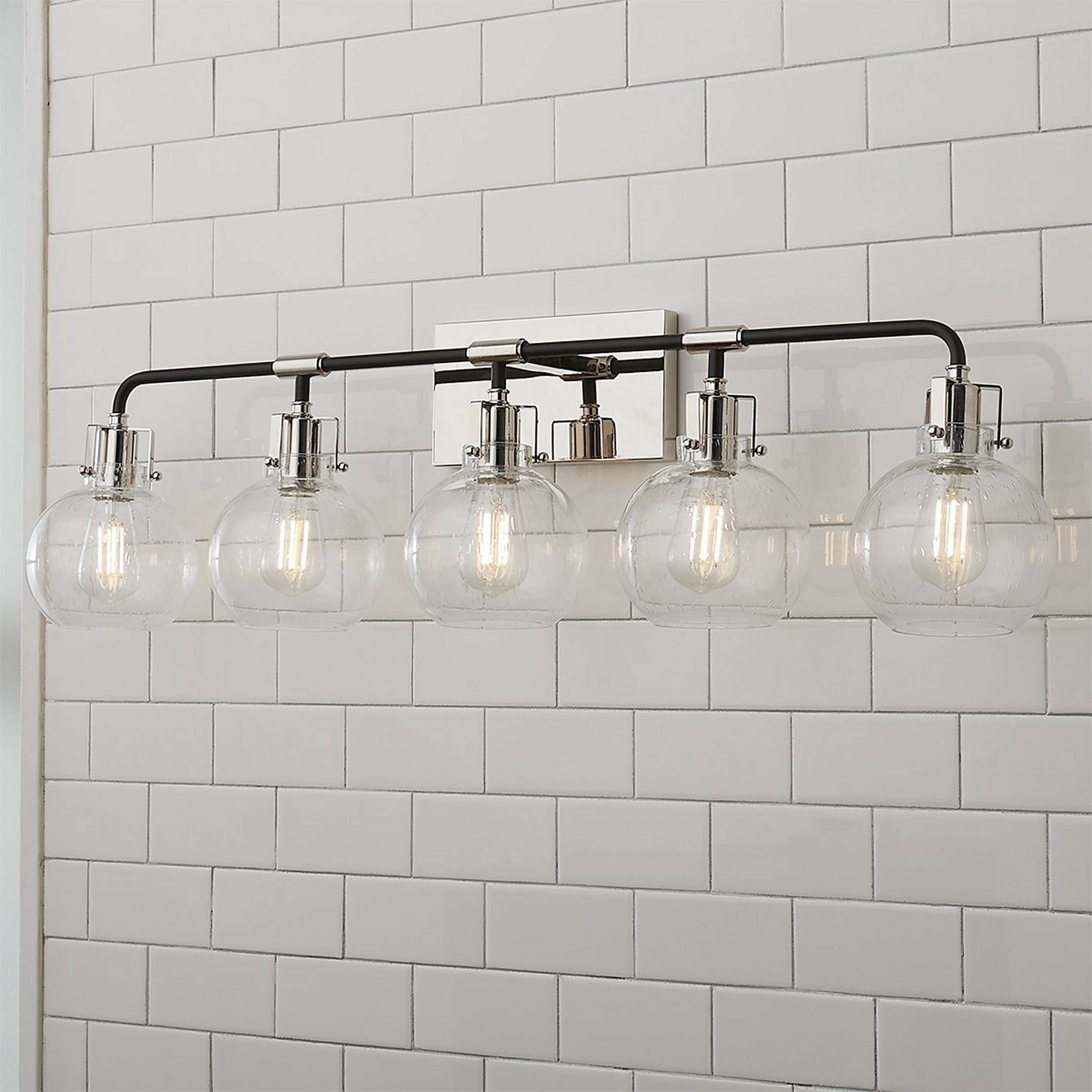 A Hinley Seeded Glass Vanity Light - 5 Light with Polished Nickel / Black color