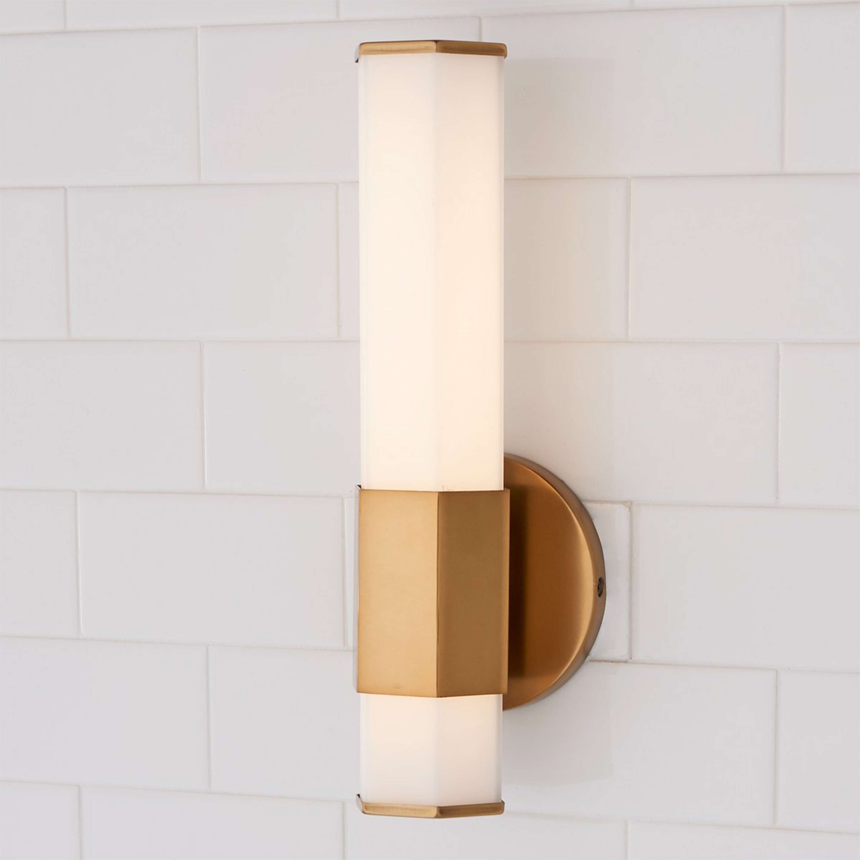 A Contemporary Hexagon LED Bath Sconce with Aged Brass color