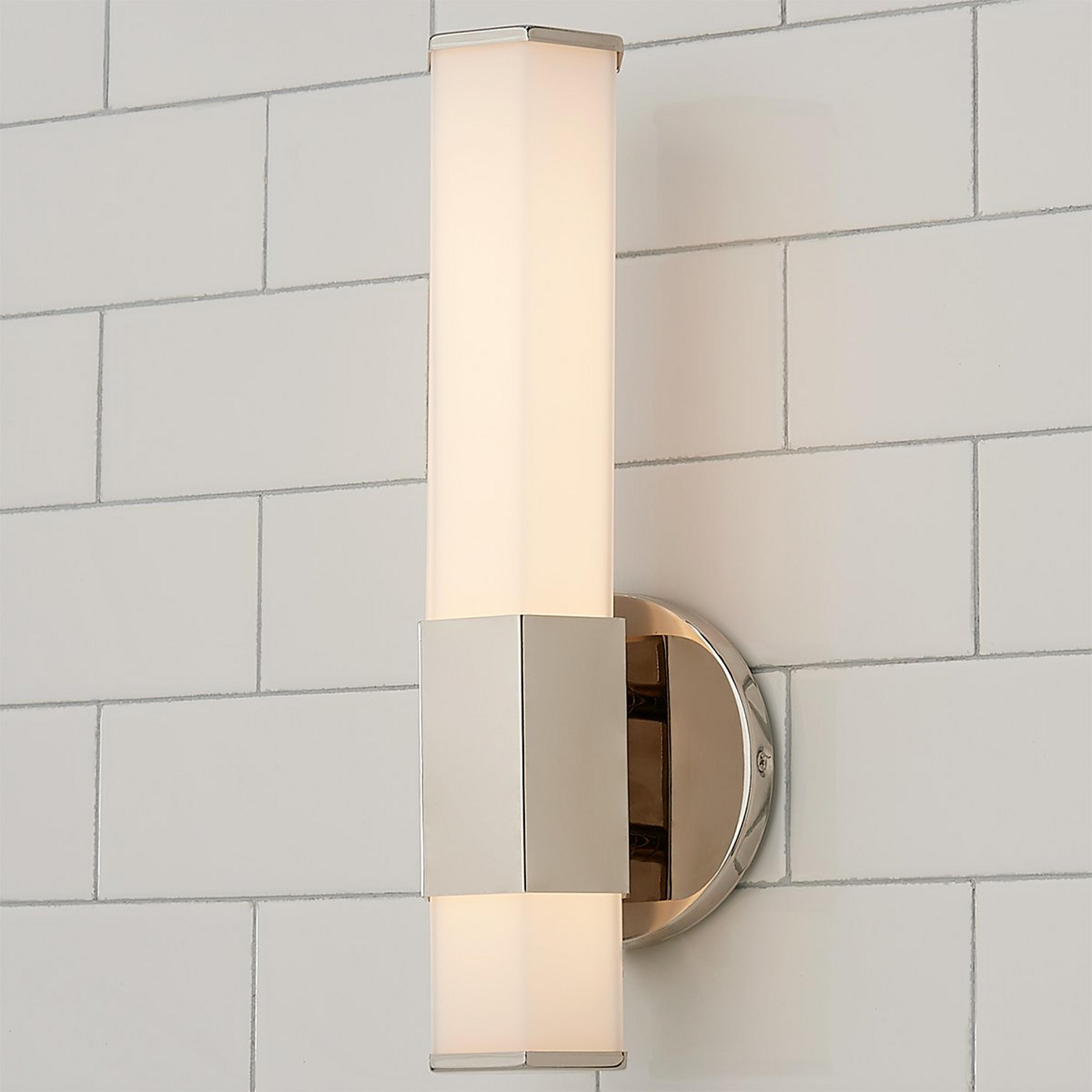 A Contemporary Hexagon LED Bath Sconce with Polished Nickel color