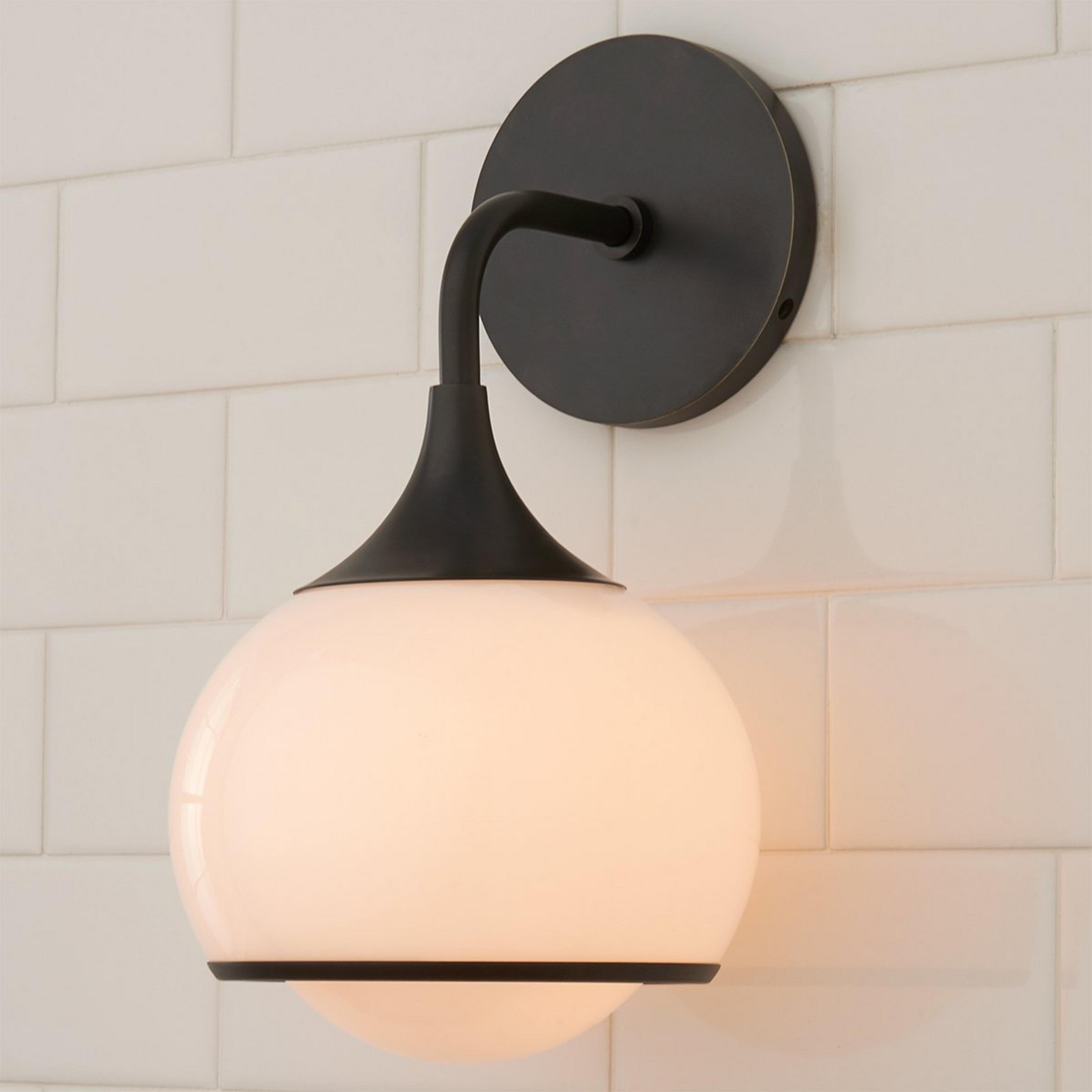 A Diner Drop Sconce with Bronze / White Glass color