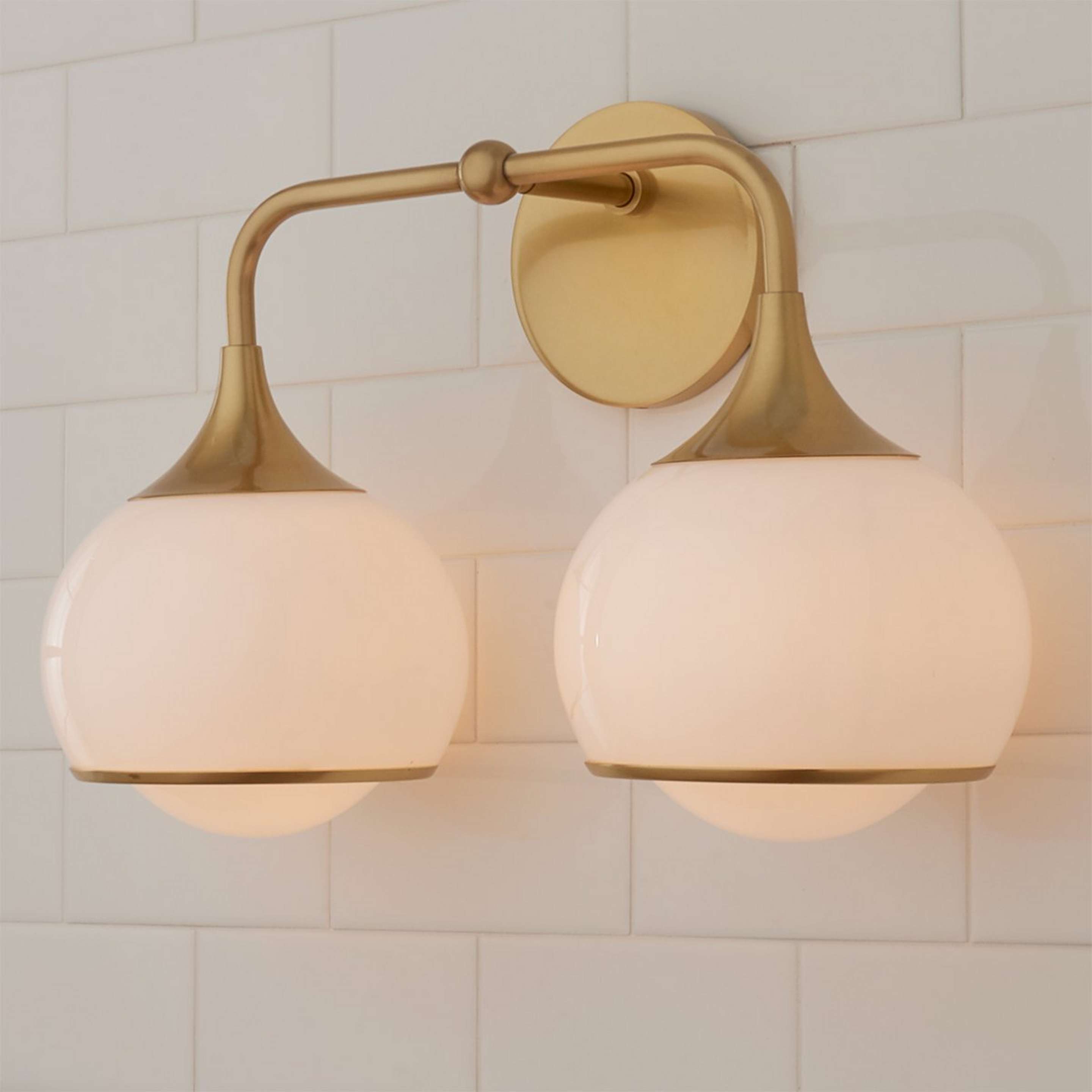 A Diner Drop Vanity Light - 2 Light with Aged Brass / White Glass color