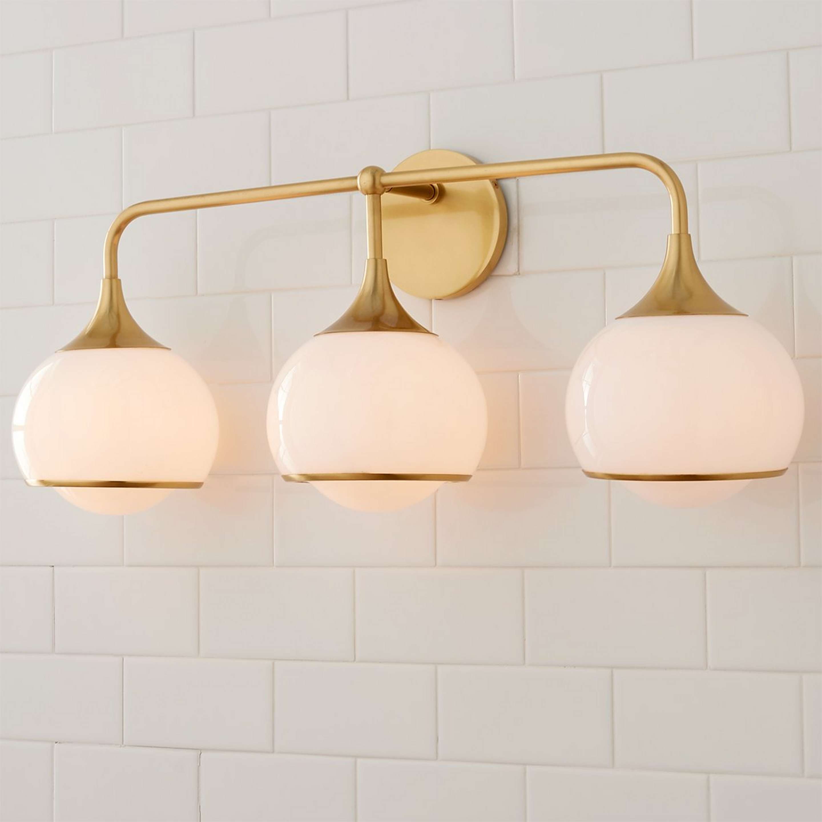 A Diner Drop Vanity Light - 3 Light with Aged Brass / White Glass color