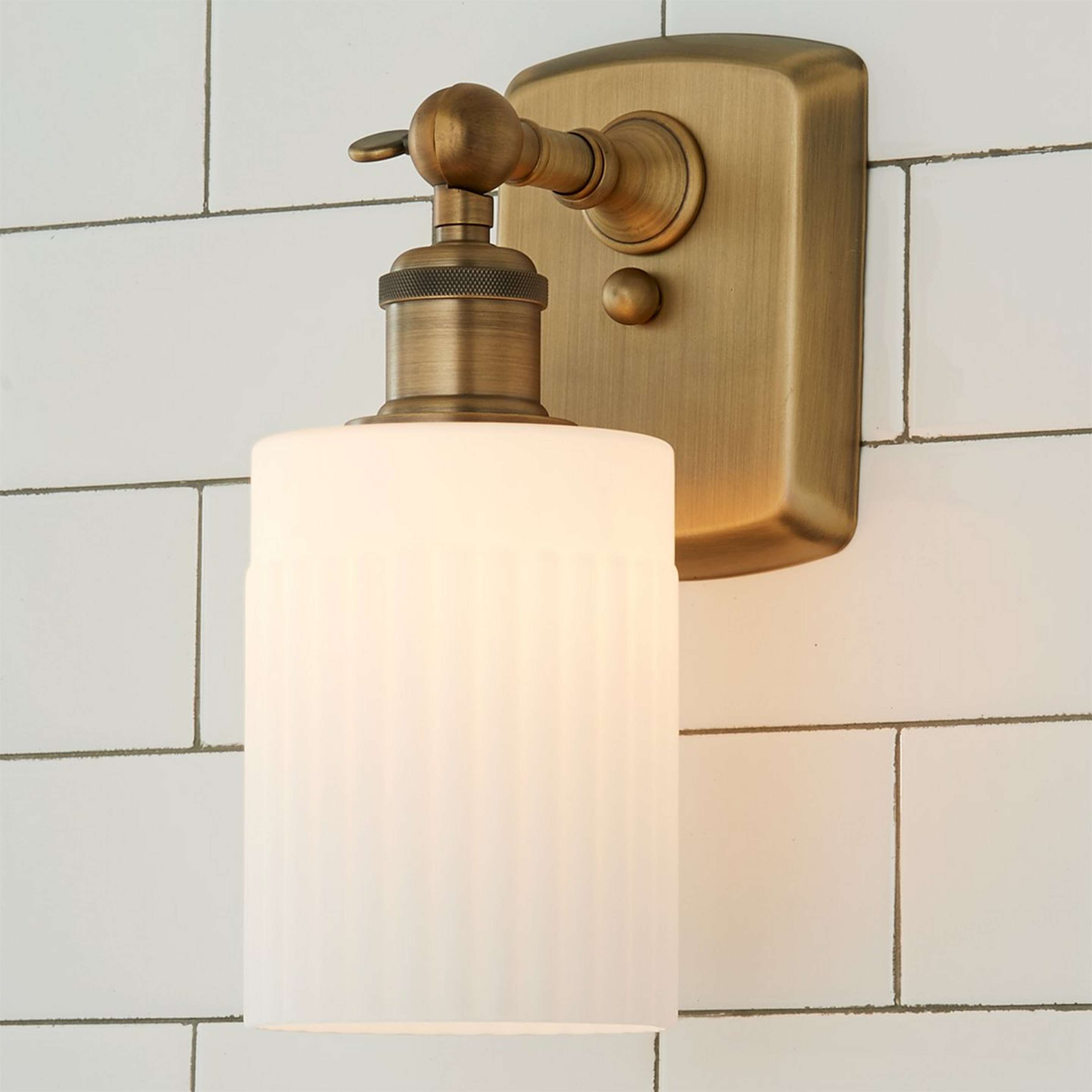 A Ridged Austin Opal Glass Bath Sconce with Brushed Brass / Opal Glass color