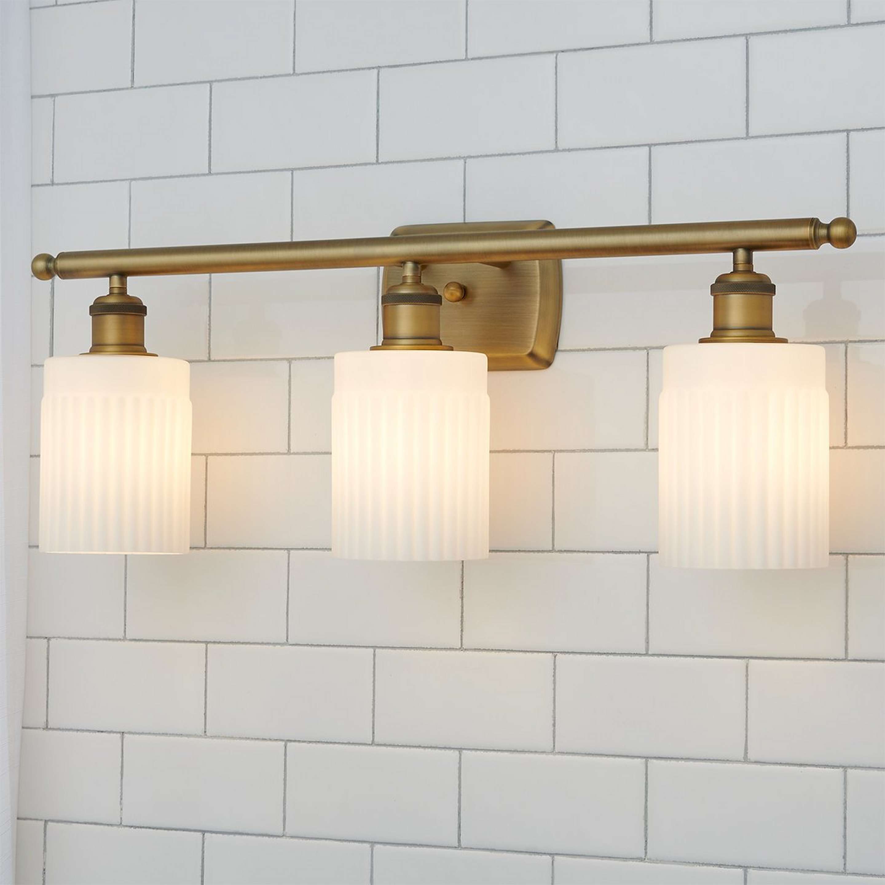 A Ridged Austin Opal Glass Vanity Light - 3 Light with Brushed Brass / Opal Glass color