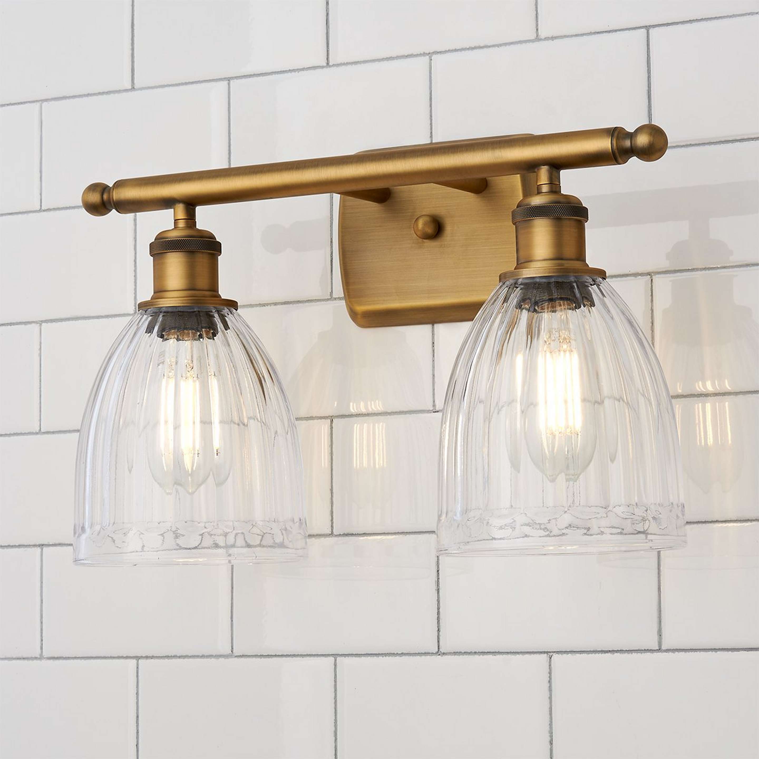 A Vintage Update Vanity Light - 2 Light with Brushed Brass color