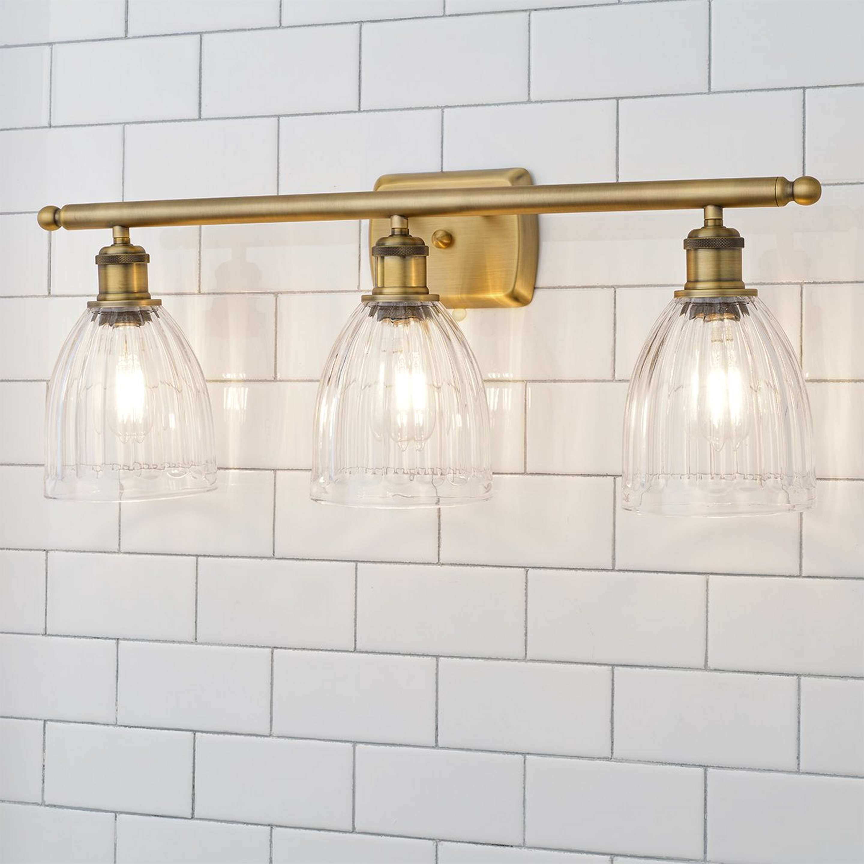 A Vintage Update Vanity Light - 3 Light with Brushed Brass color