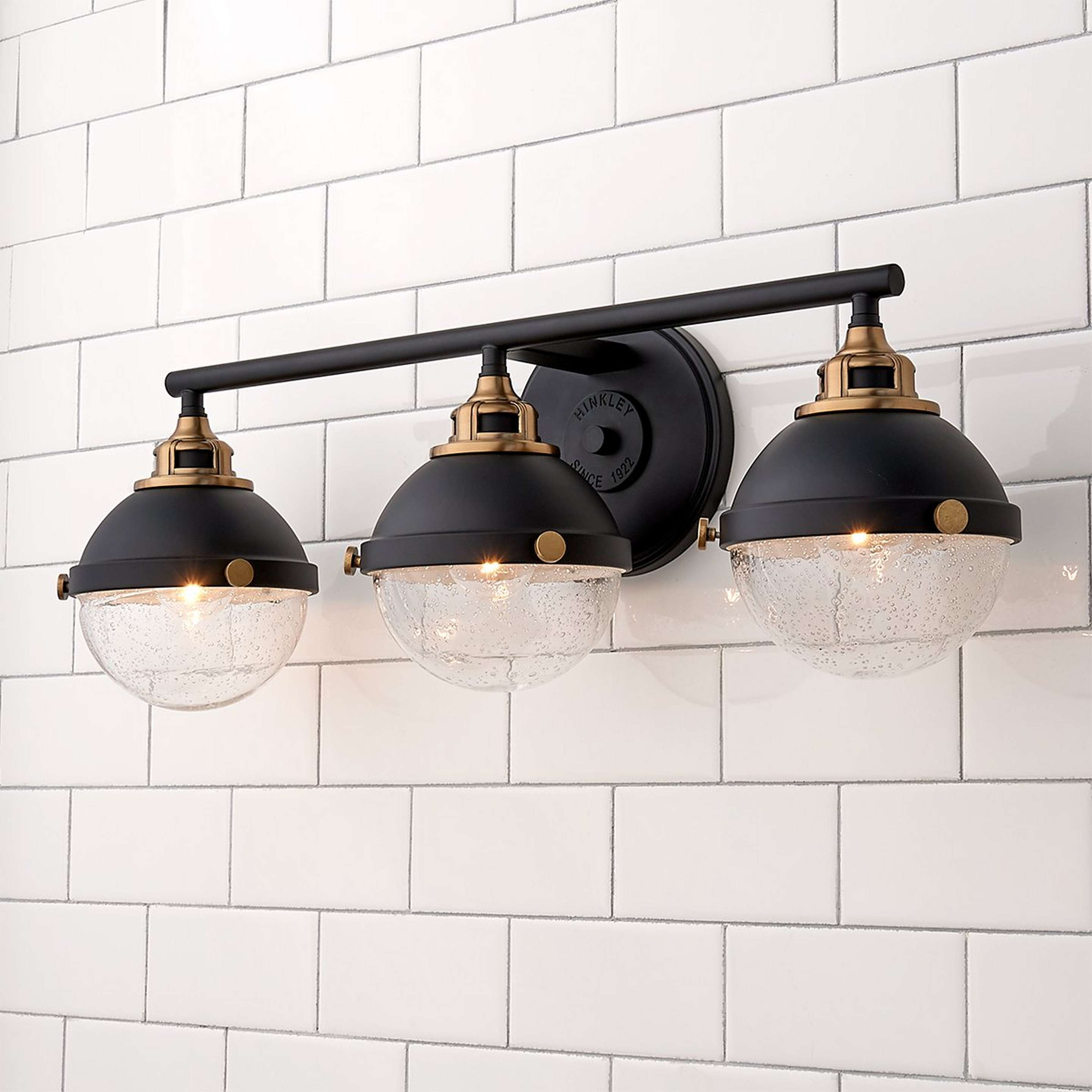 A Decor Declaration Vanity Light - 3 Light with Black / Aged Brass / Seeded Glass color