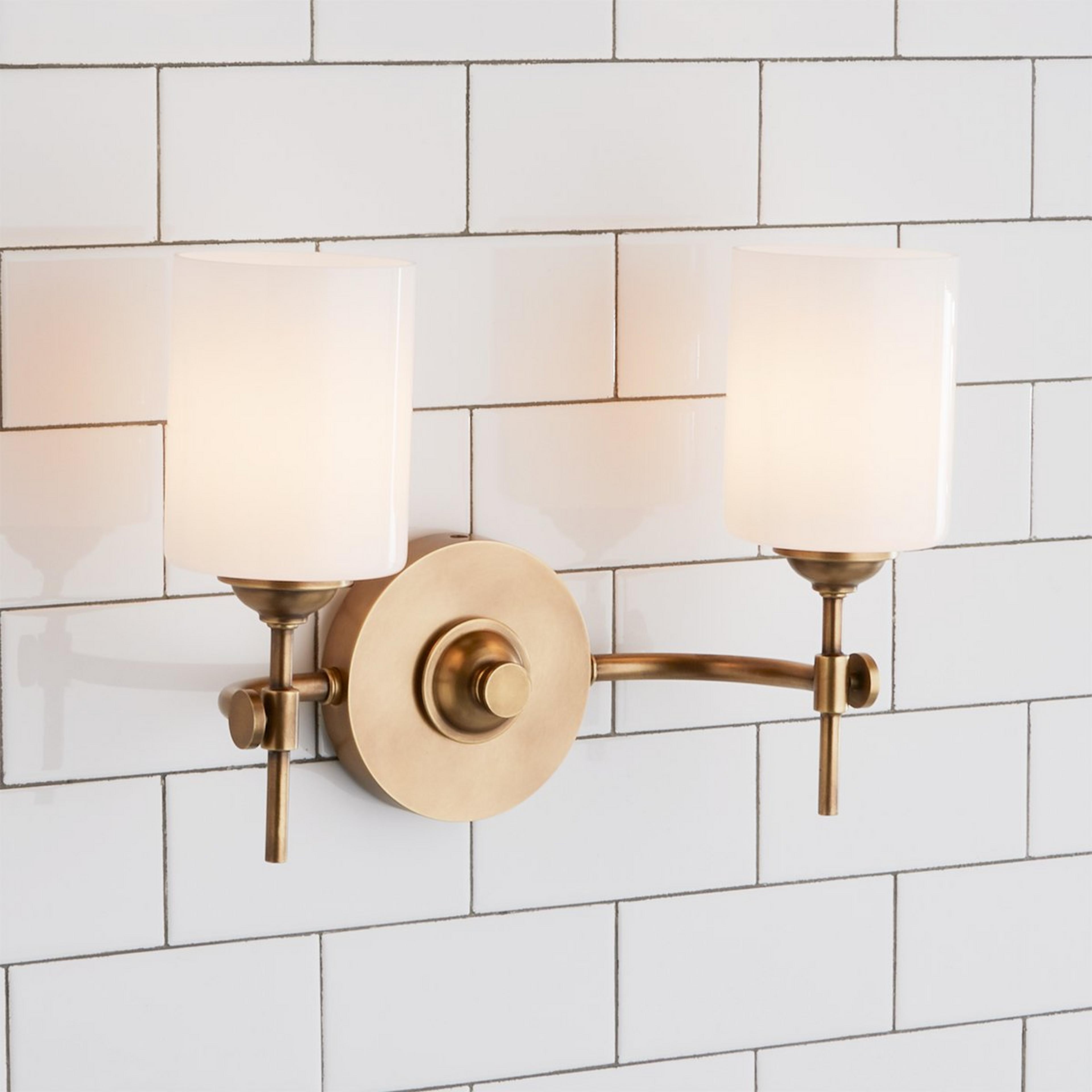 A Jerdora Opal Glass Vanity Light - 2 Light with Aged Brass / Opal Glass color