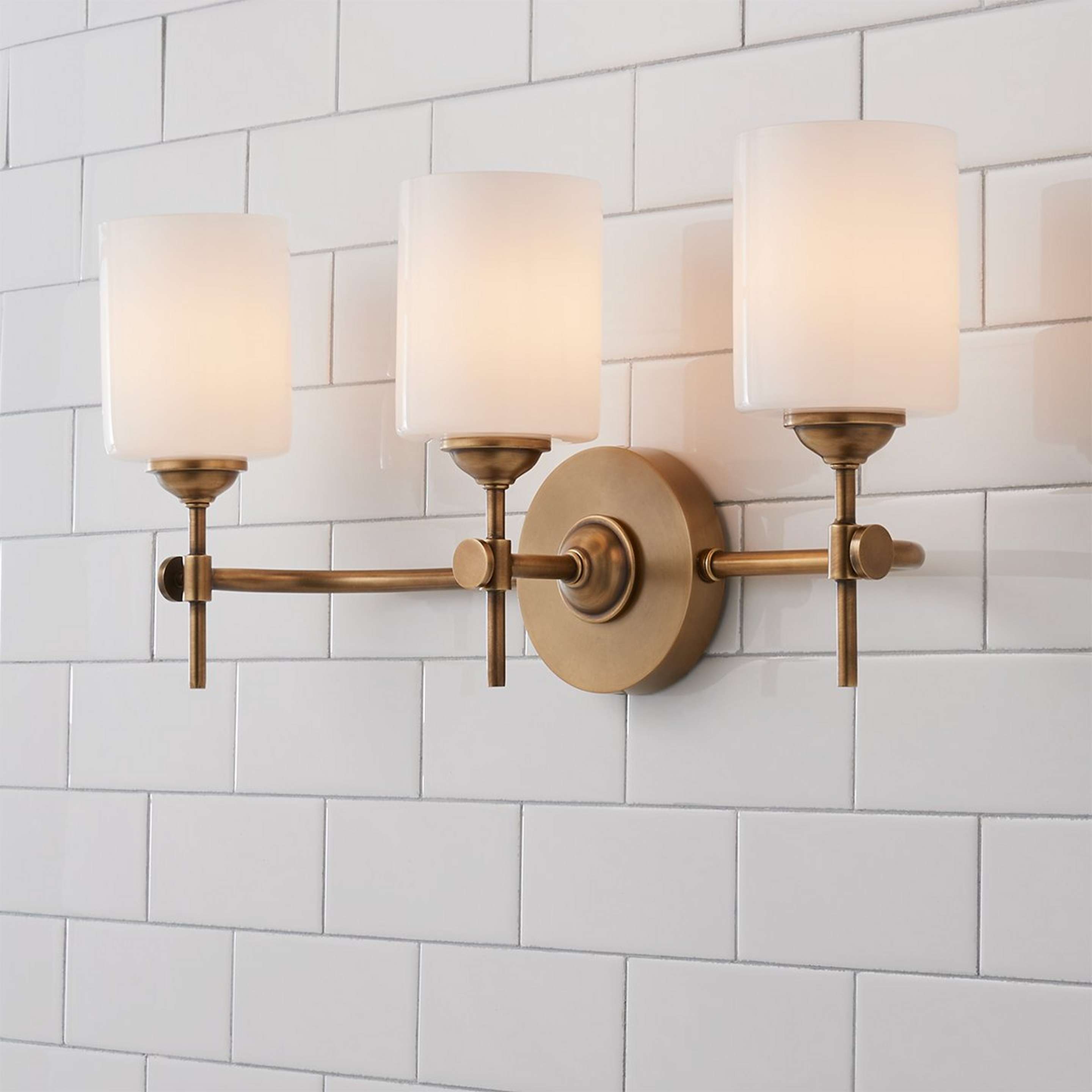 A Jerdora Opal Glass Vanity Light - 3 Light with Aged Brass / Opal Glass color