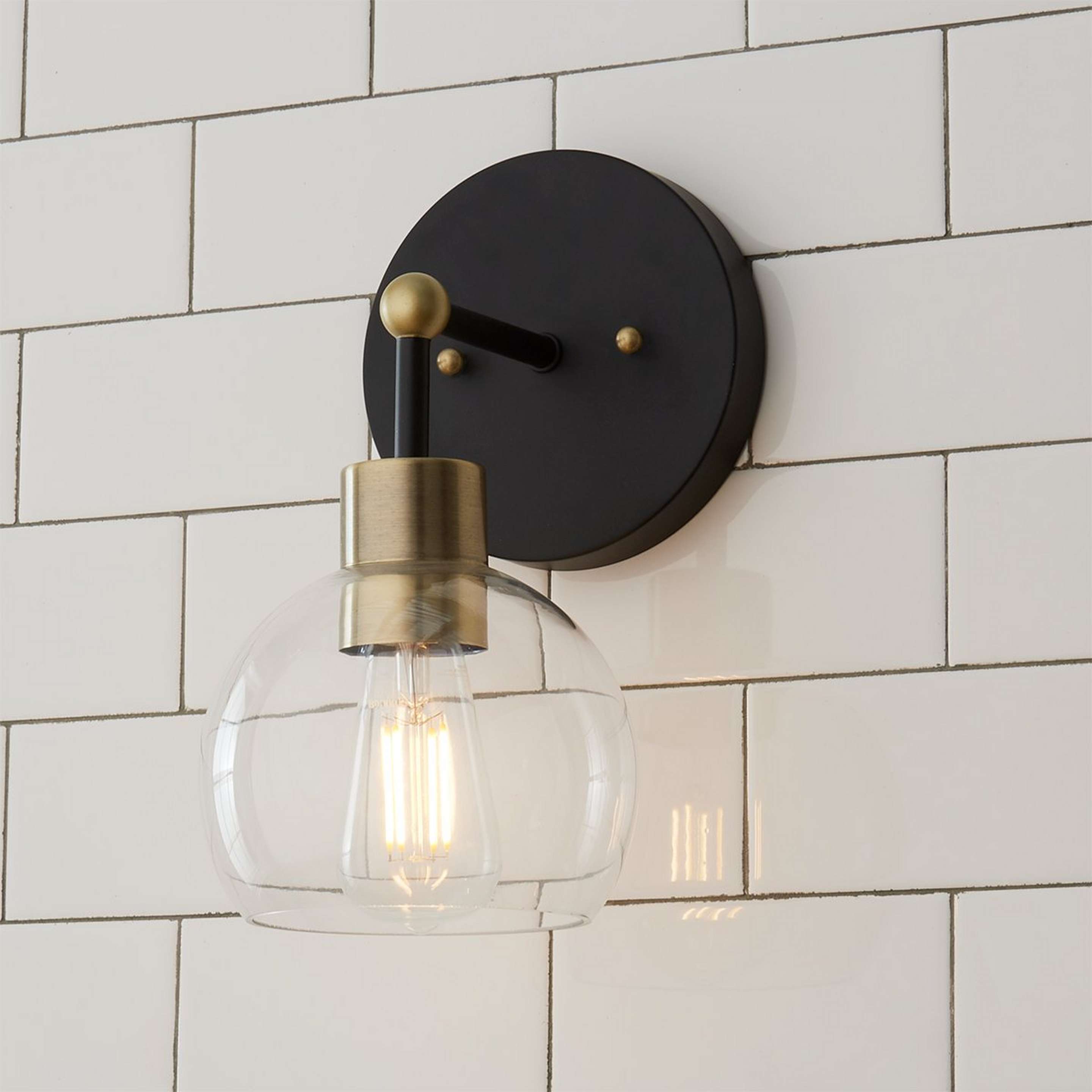 A Young House Love Clear Glass Bubble Sconce with Bronze / Clear Glass / Brass color