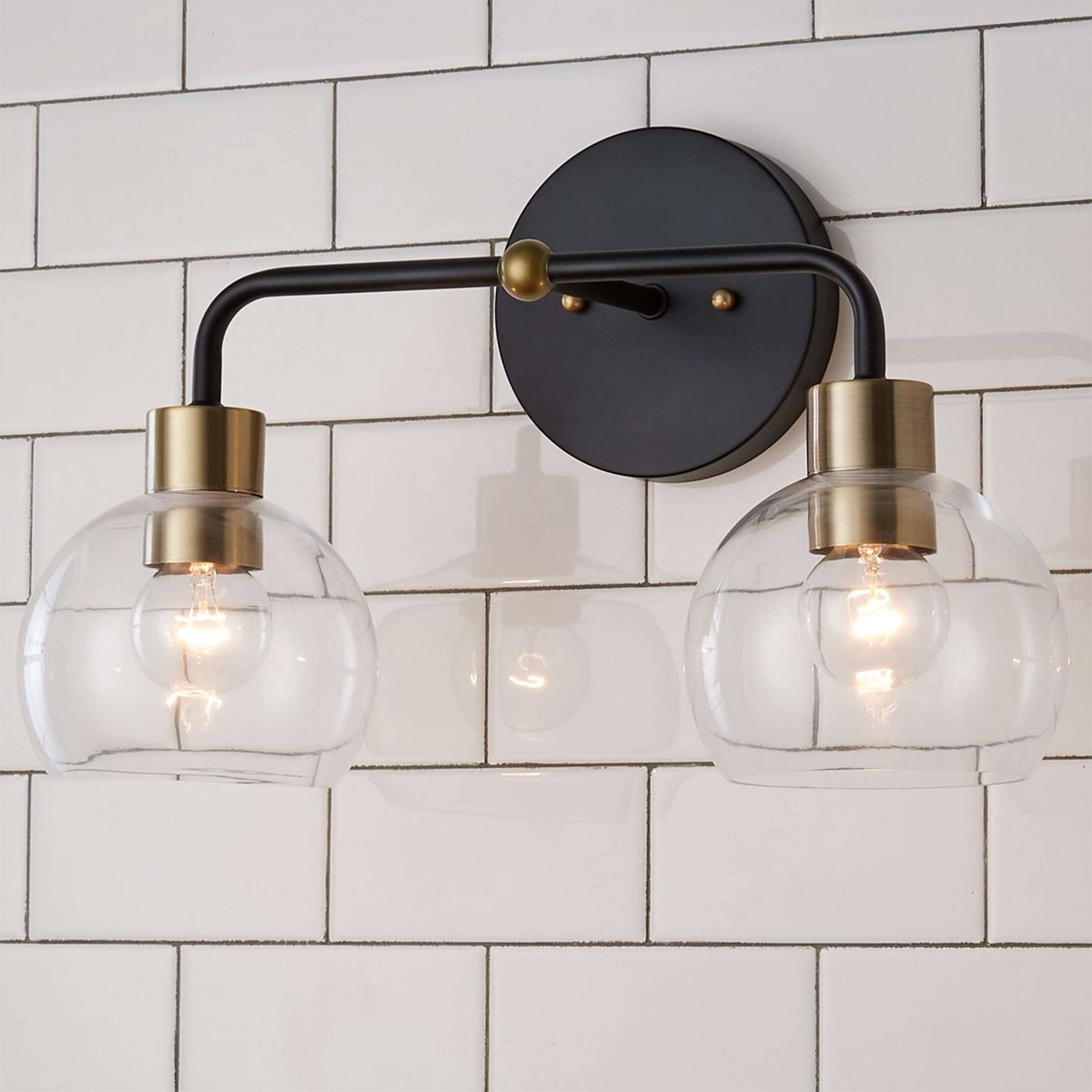 A Young House Love Clear Glass Bubble Vanity Light - 2 Light with Bronze / Clear Glass / Brass color