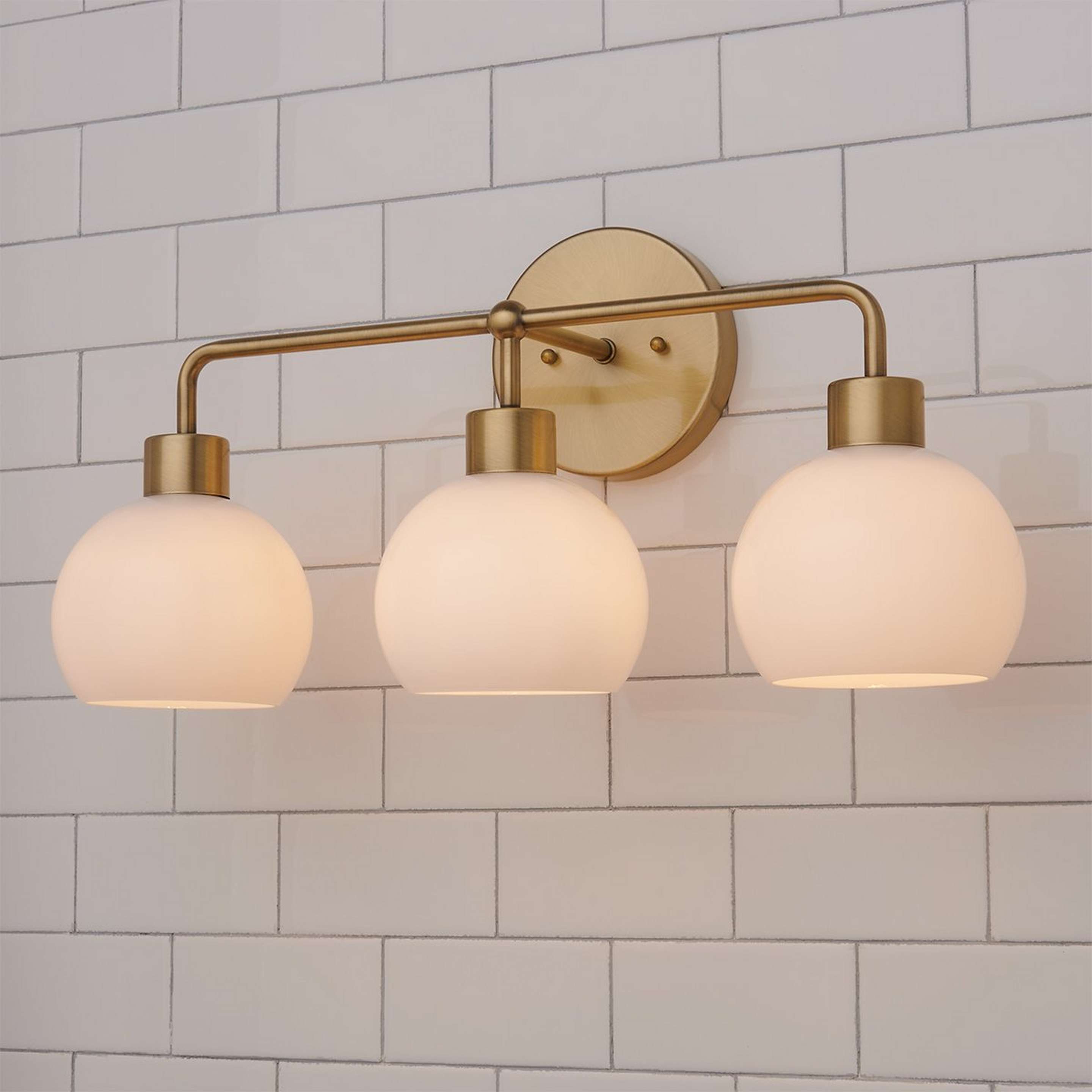 A Young House Love Opal Glass Bubble Vanity Light - 3 Light with Brass / Opal Glass color