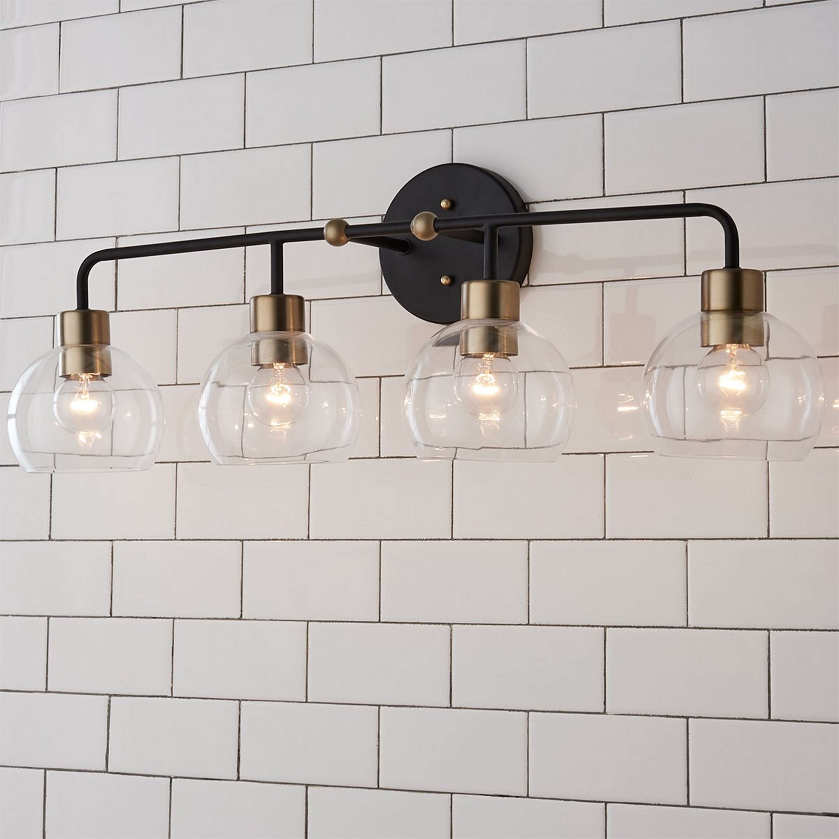 A Young House Love Clear Glass Bubble Vanity Light - 4 Light with Bronze / Clear Glass / Brass color