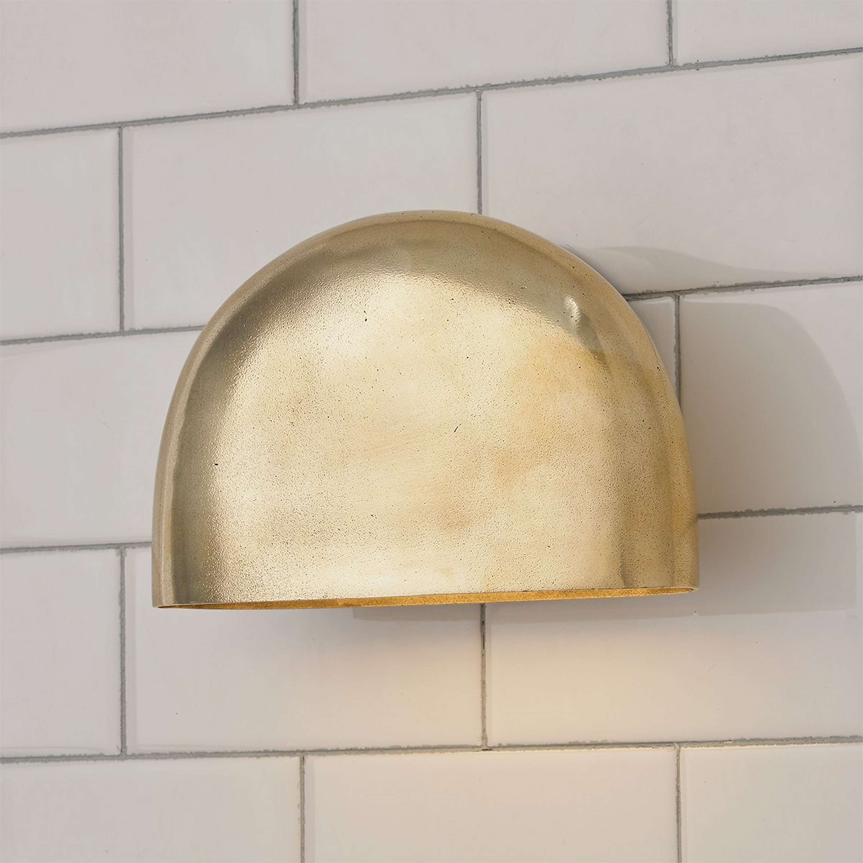 A Myron Sconce with Aged Brass color