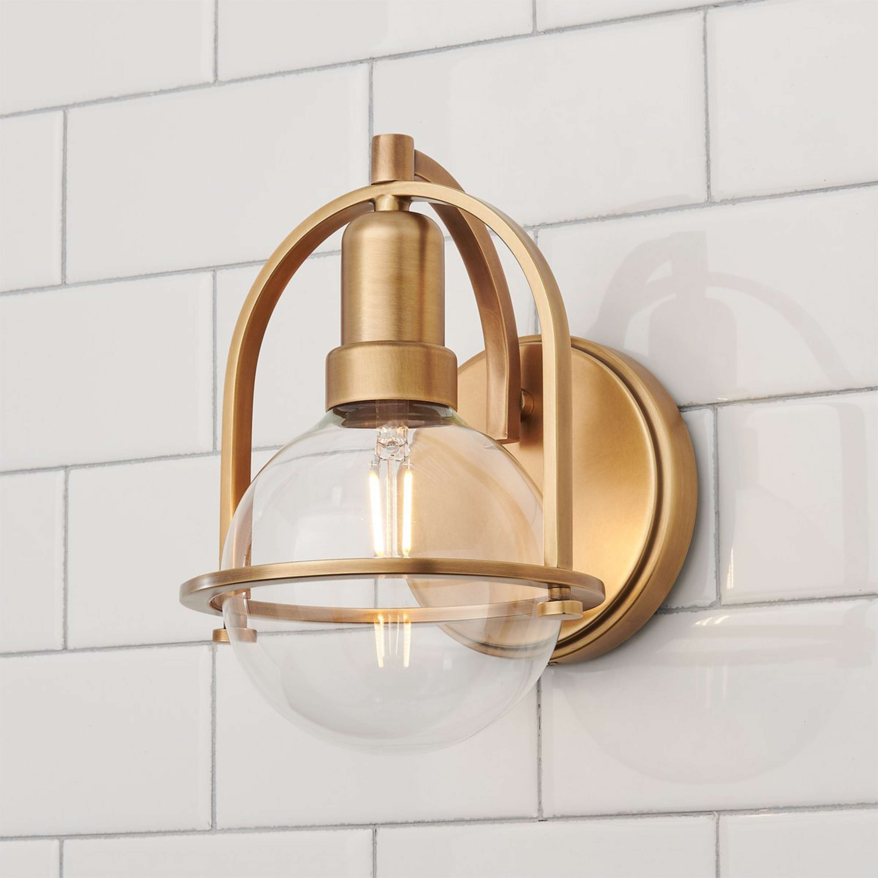 A Apogee Sconce with Aged Brass color