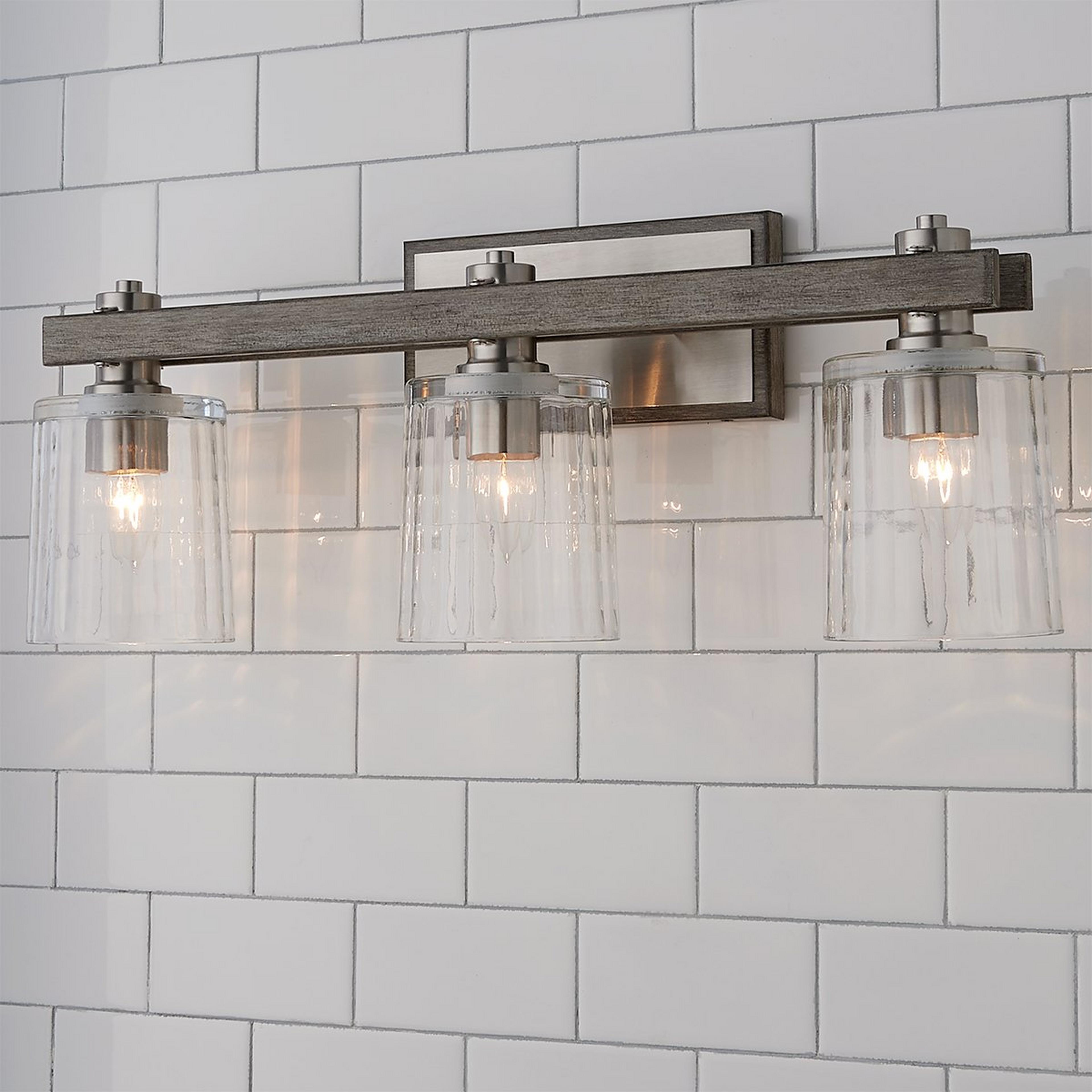 A Rustic Ripple Glass Vanity Light - 3 Light with Satin Nickel / Faux Gray Wood color