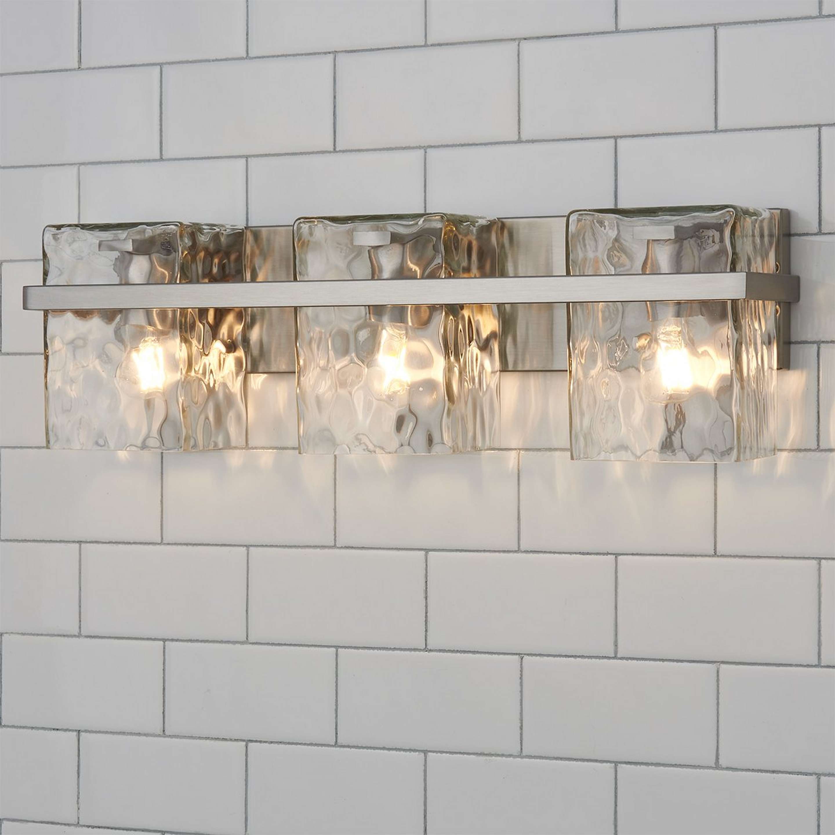 A Cinerea Vanity Light - 3 Light with Brushed Nickel / Clear Wavy Glass color