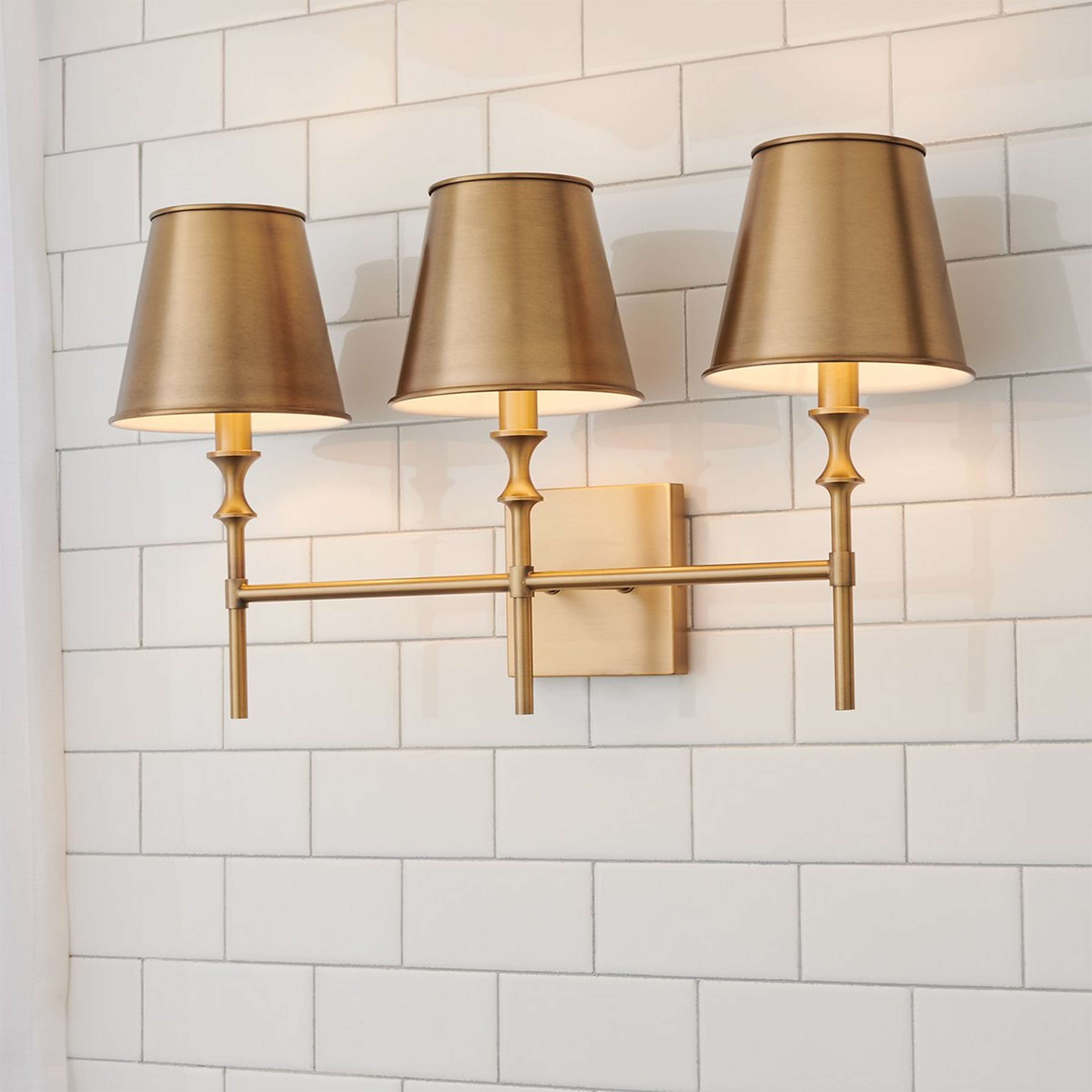 A Antigue Vanity Light - 3 Light with Aged Brass color