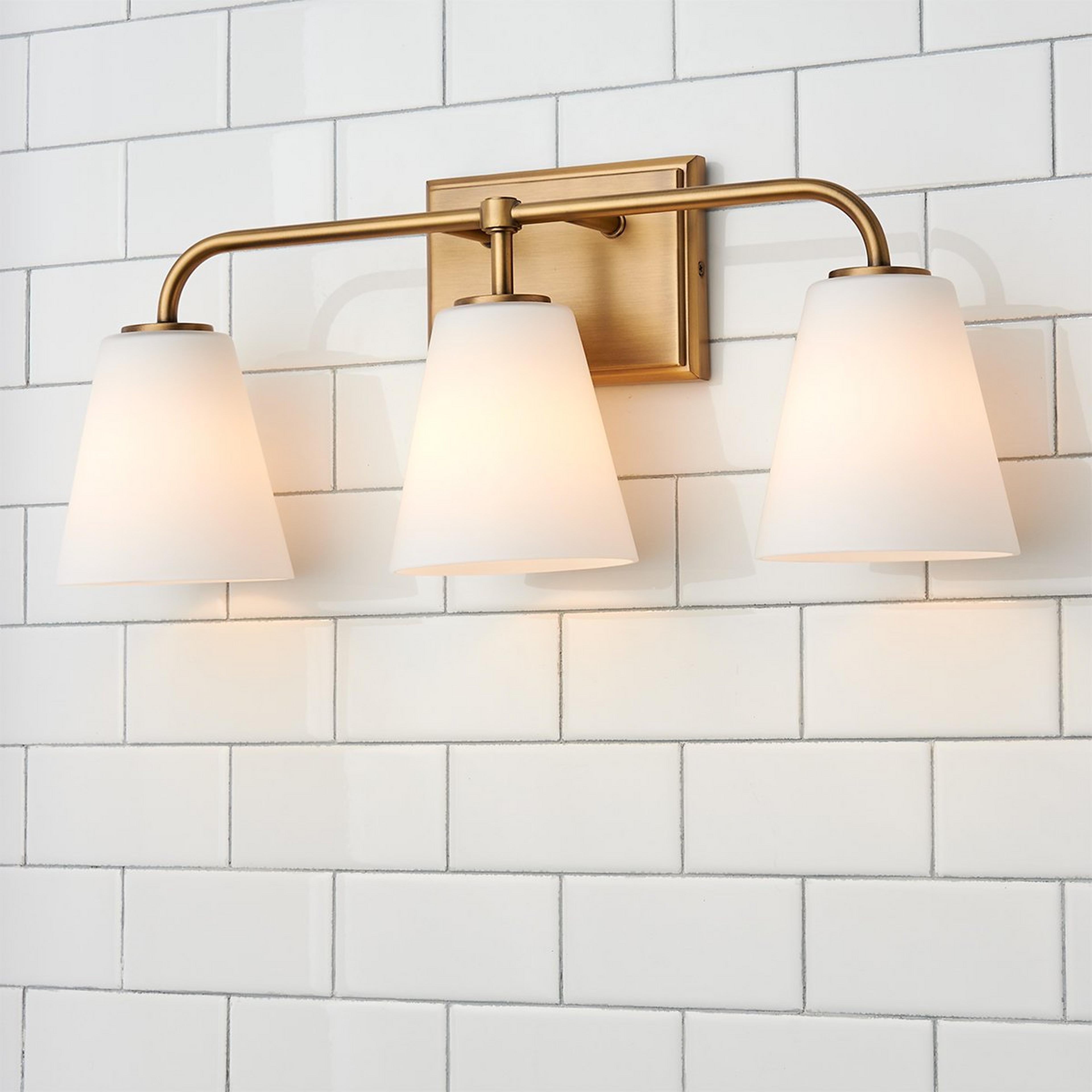 A Westchase Vanity Light - 3 Light with Aged Brass / Milk Glass color