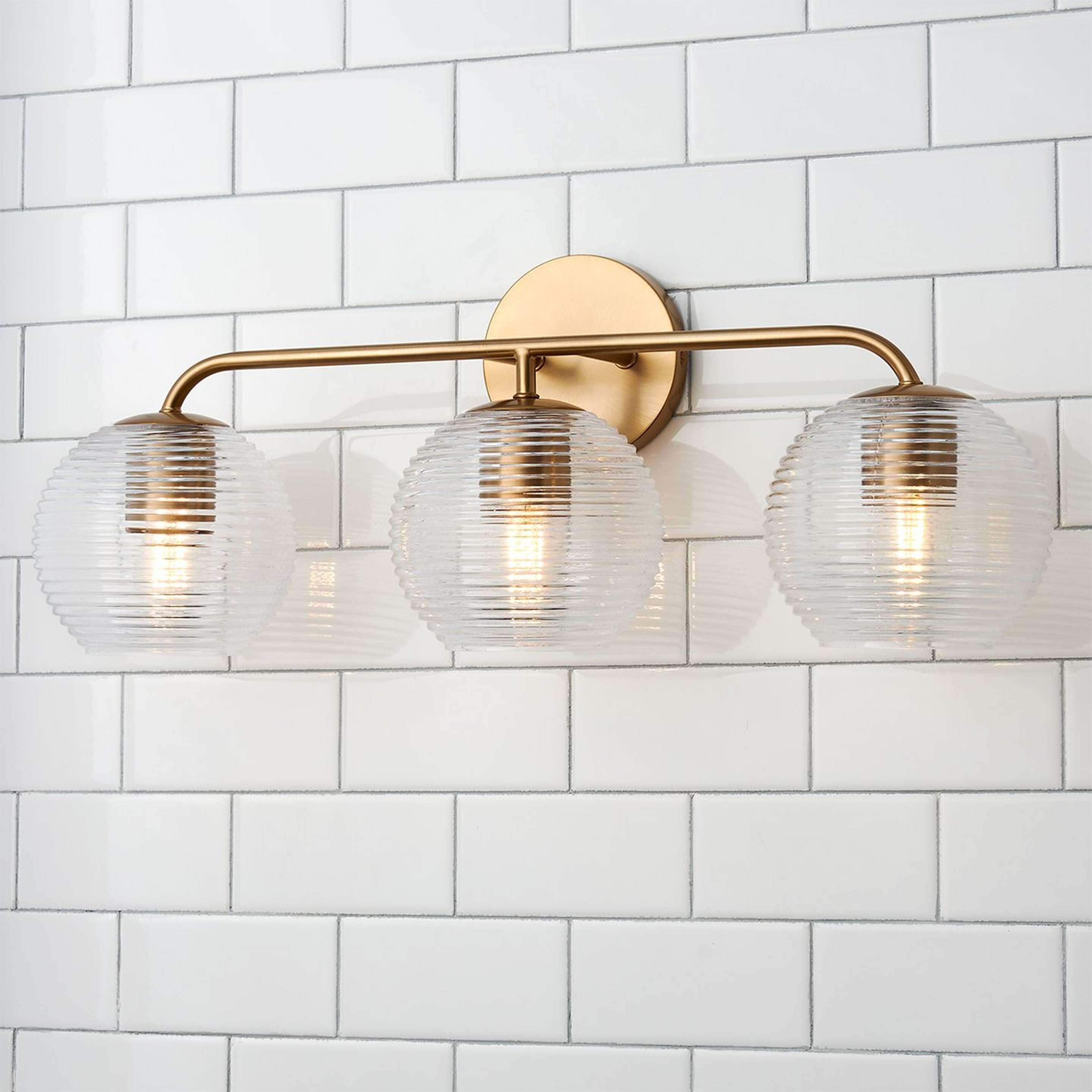 A Alainey Vanity Light - 3 Light with Matte Brass / Clear Ribbed Glass color