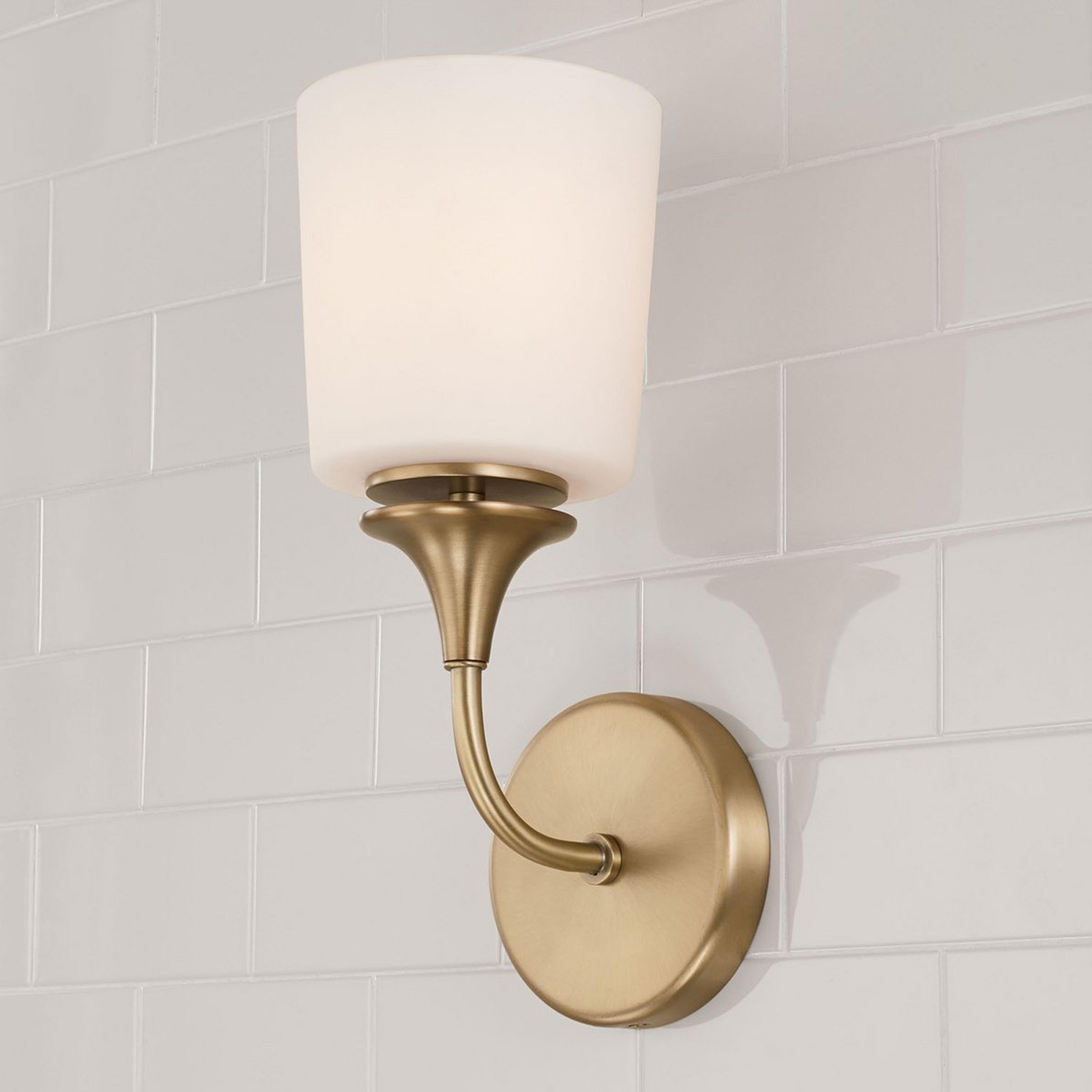 A Mayhue Bath Sconce with Aged Brass / Milk Glass color