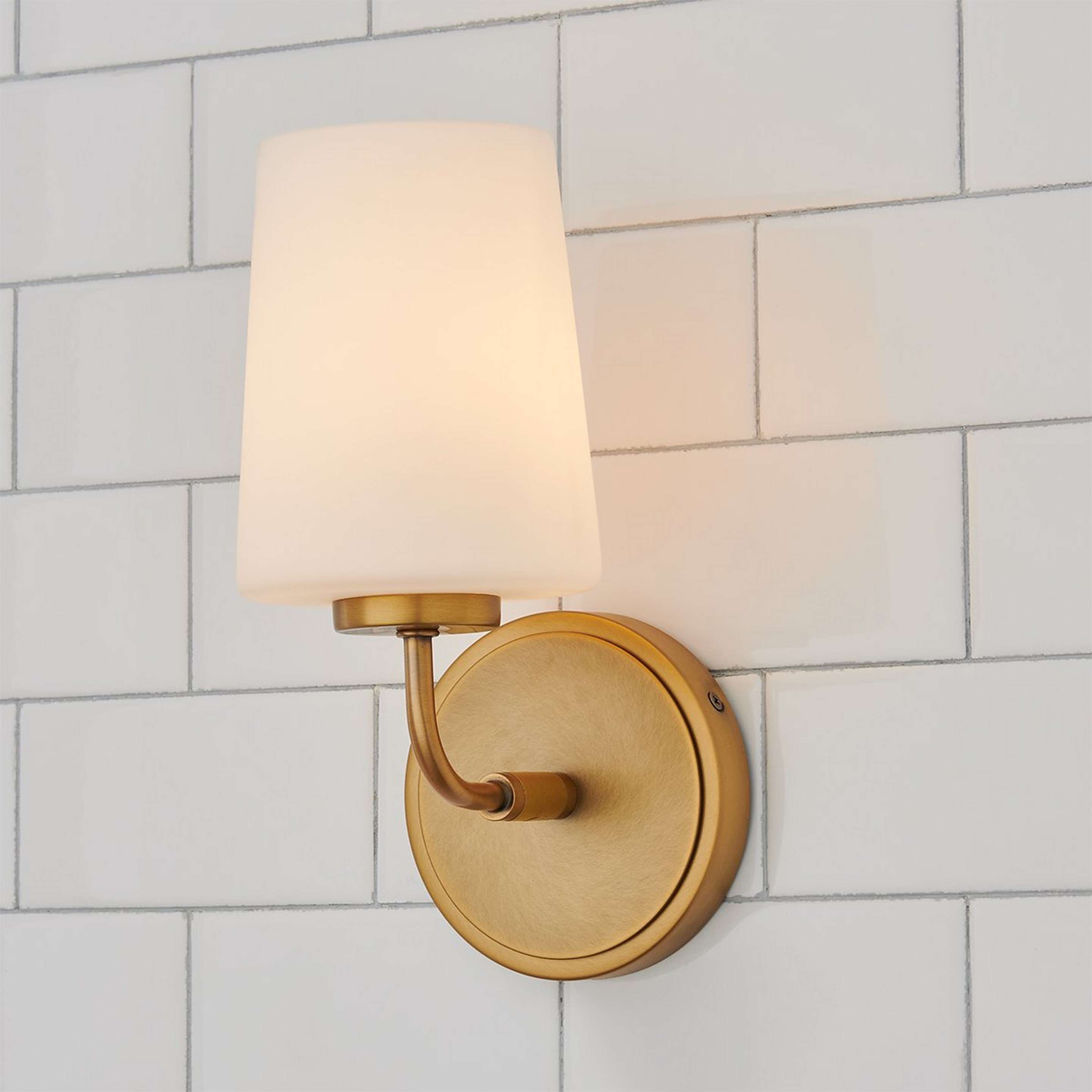 A Jeida Bath Sconce with Brass / Opal Glass color